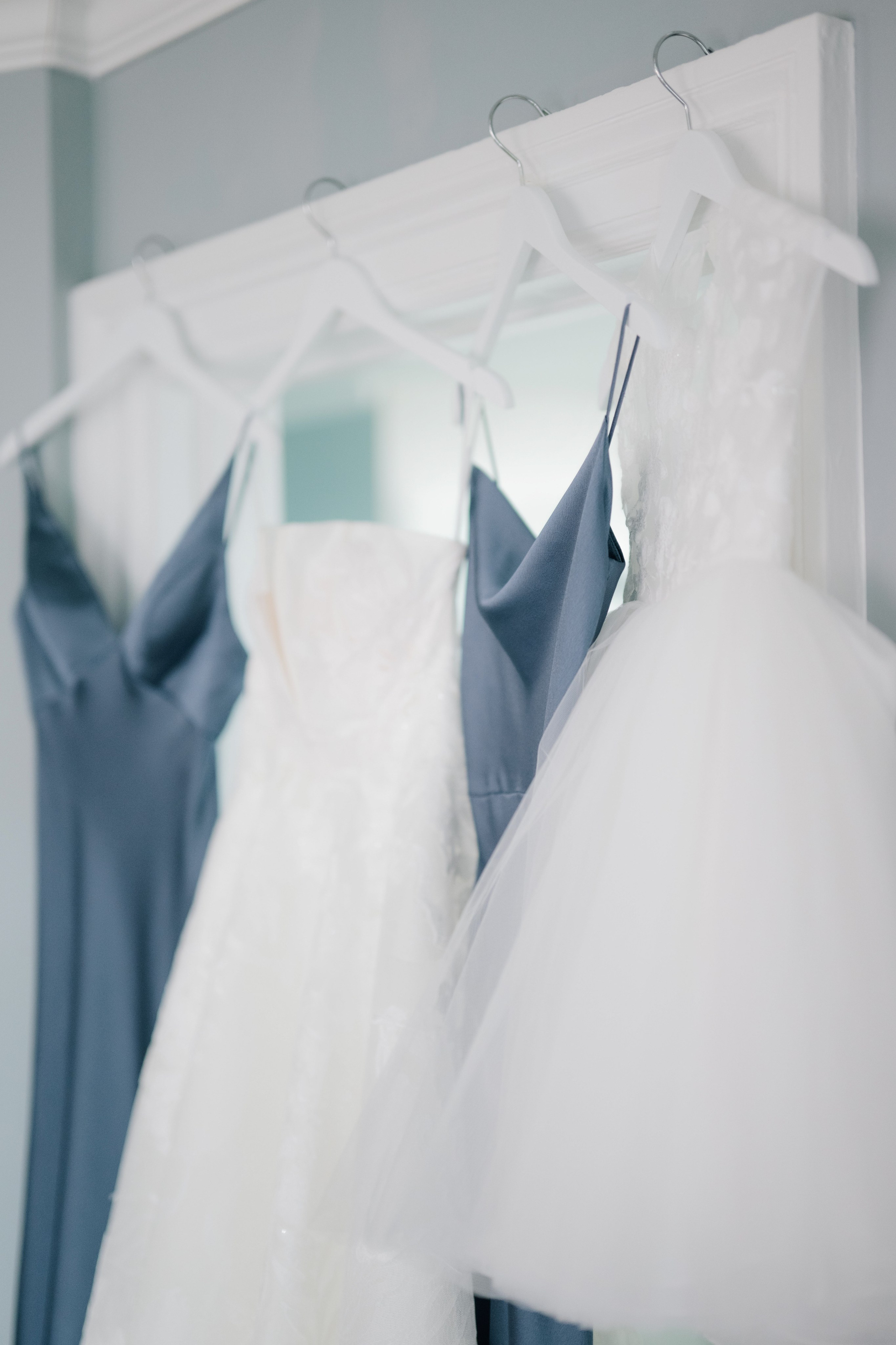 a row of dresses hanging on a rack