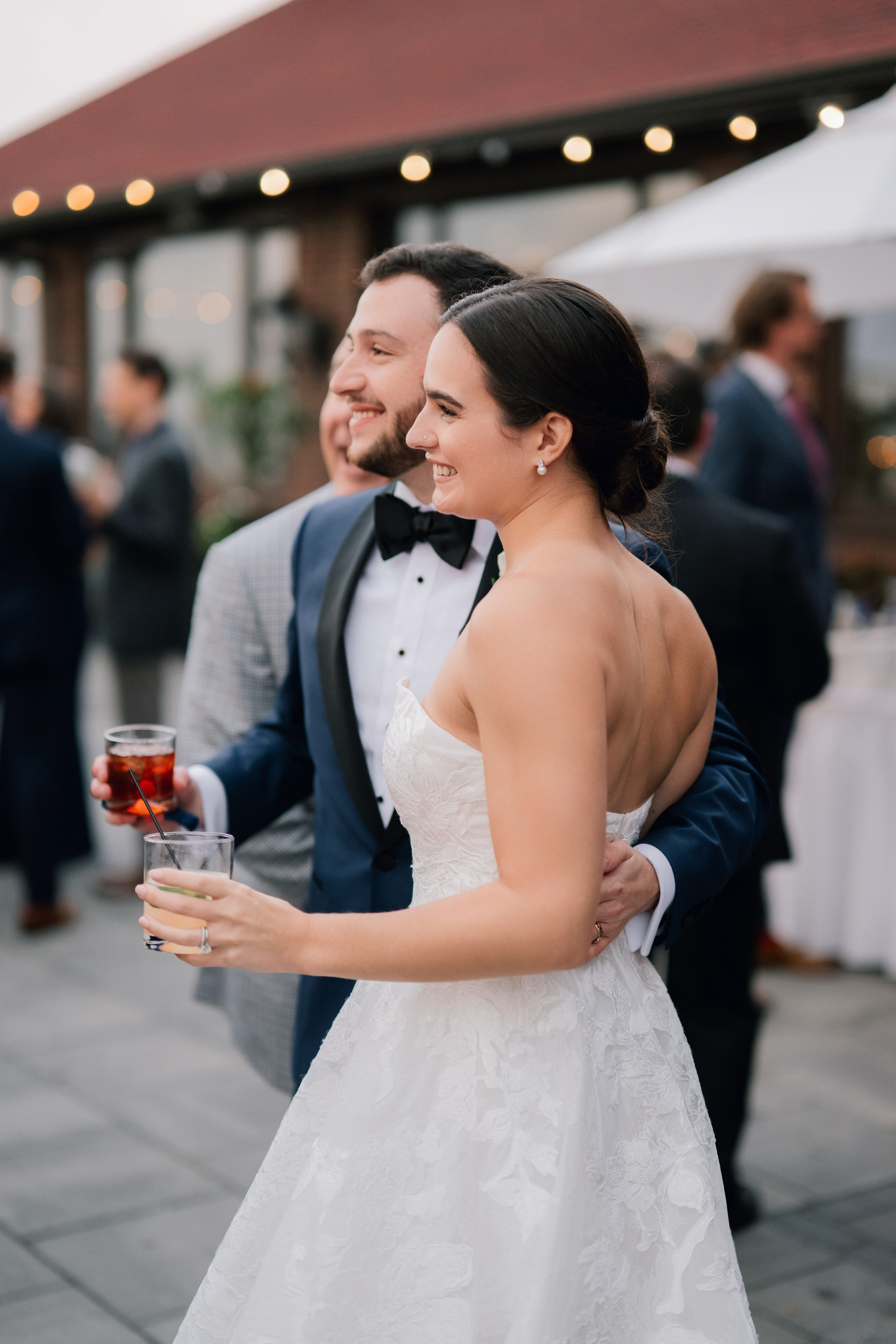 a bride and groom are standing outside at their wedding