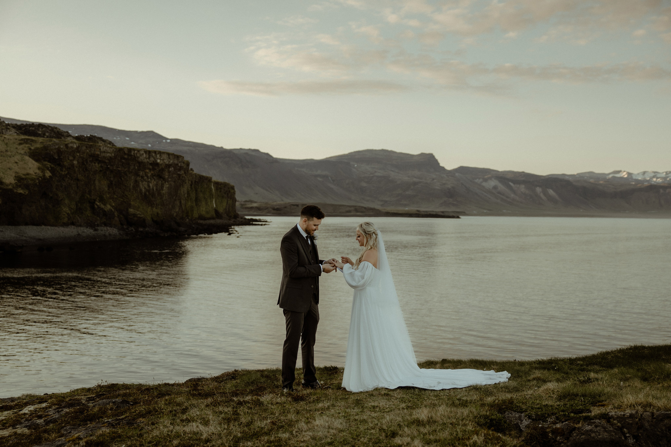 Iceland elopement at Budir with midnight sun wedding photos at black sand beach. Iceland elopement photographer & videographer