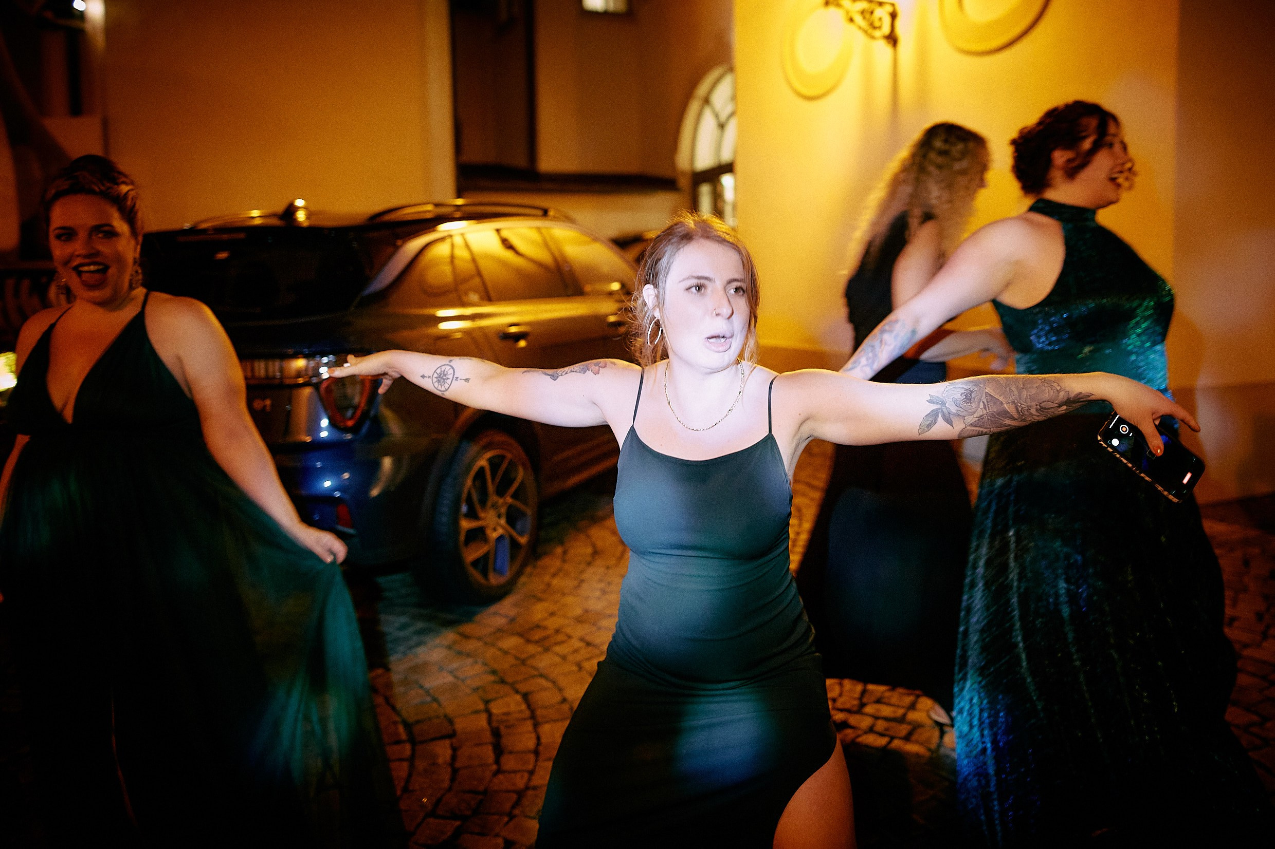 Guest celebrating bouquet catch excitedly.