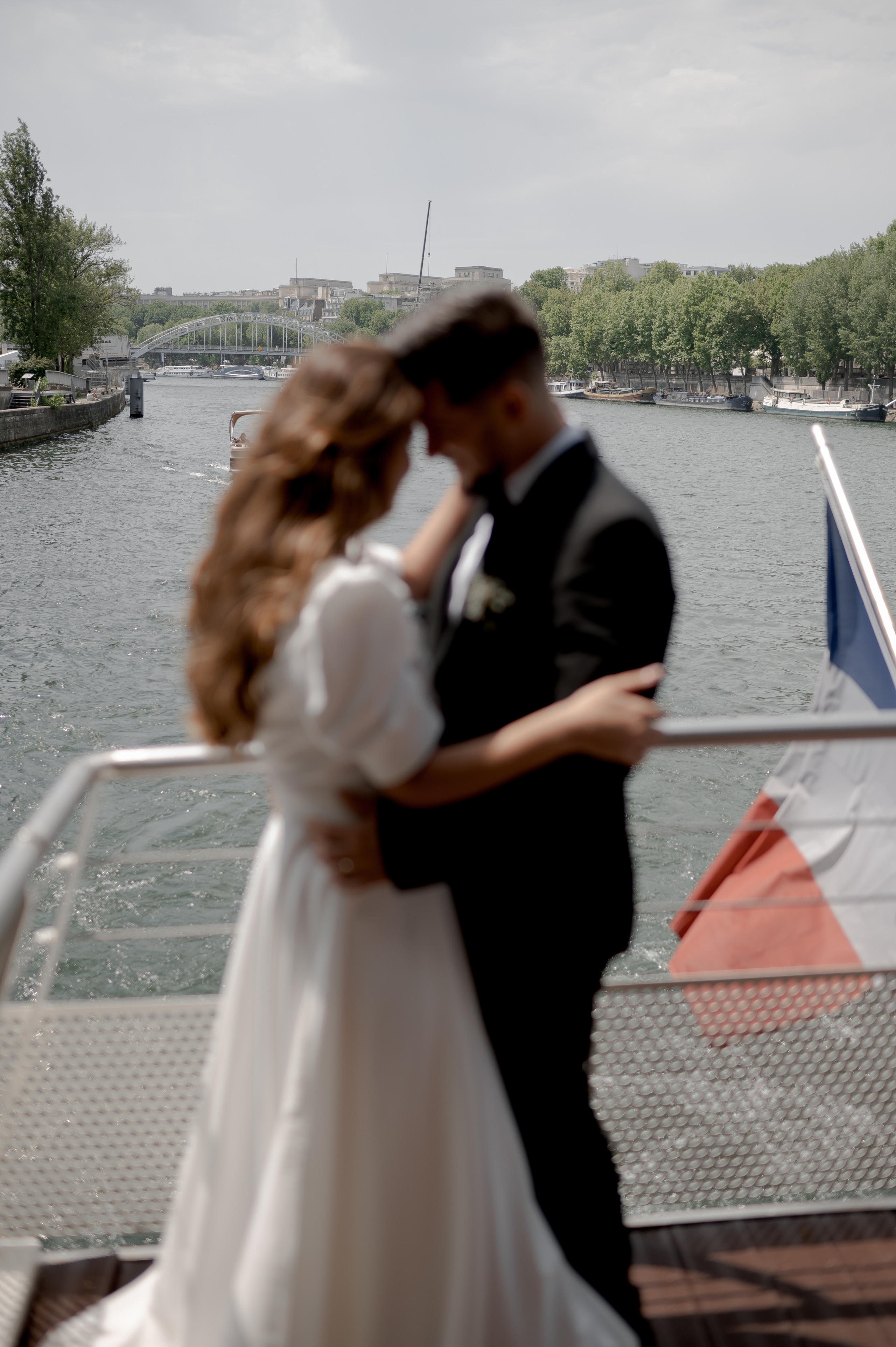 Enchanting wedding on the Seine in Paris, featuring an ASOS gown. Budget-friendly Paris wedding and low-cost photography. Destination wedding in Paris.