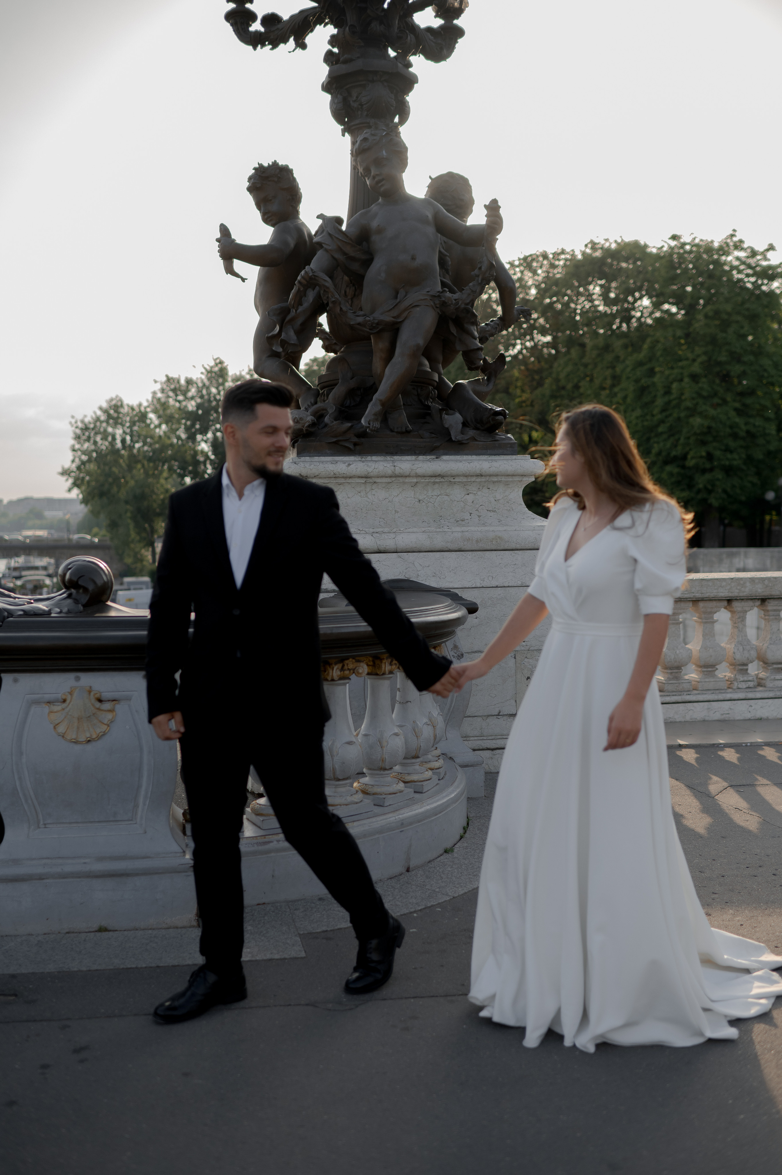 Stylish wedding on the Seine in Paris, highlighting an ASOS gown. Budget-friendly Paris wedding with a low-cost photographer. Destination wedding in Paris.