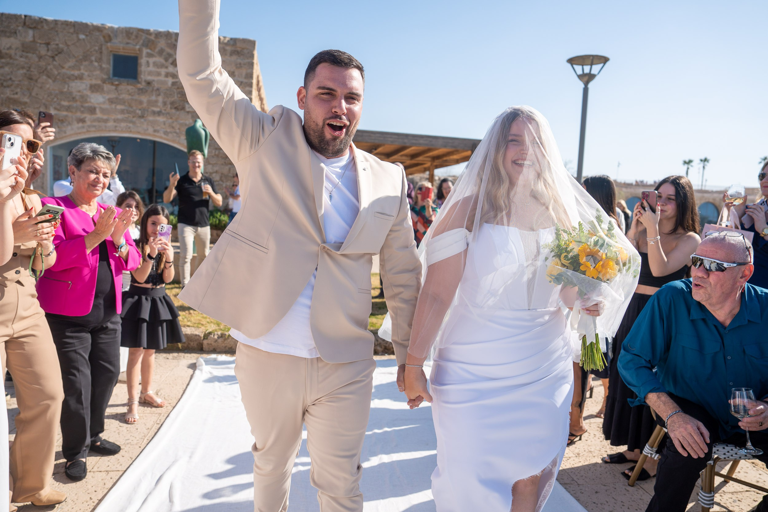 Yael and Natanel walk together towards the chuppah