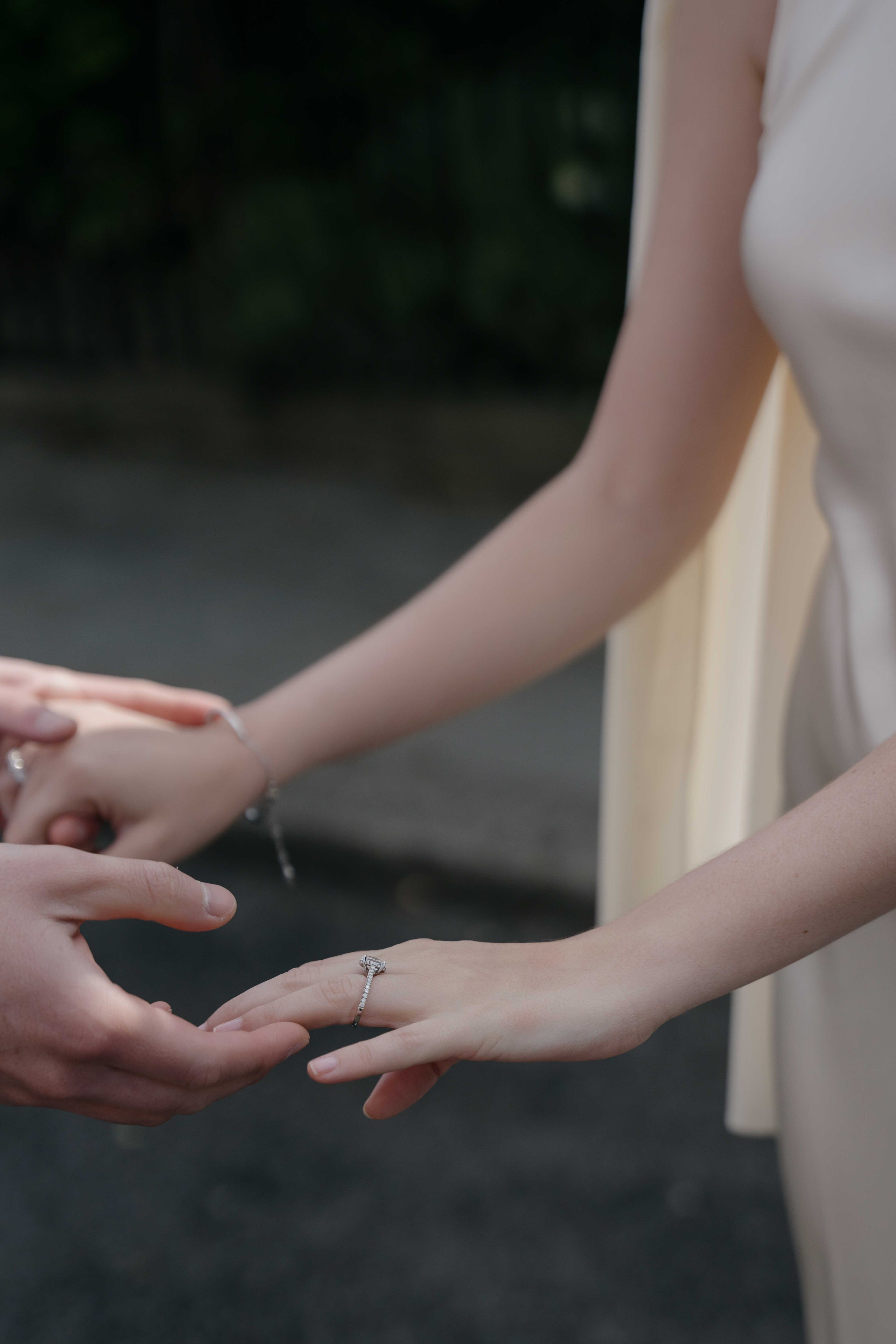 Couple holding hands with engagement ring in cinematic London session