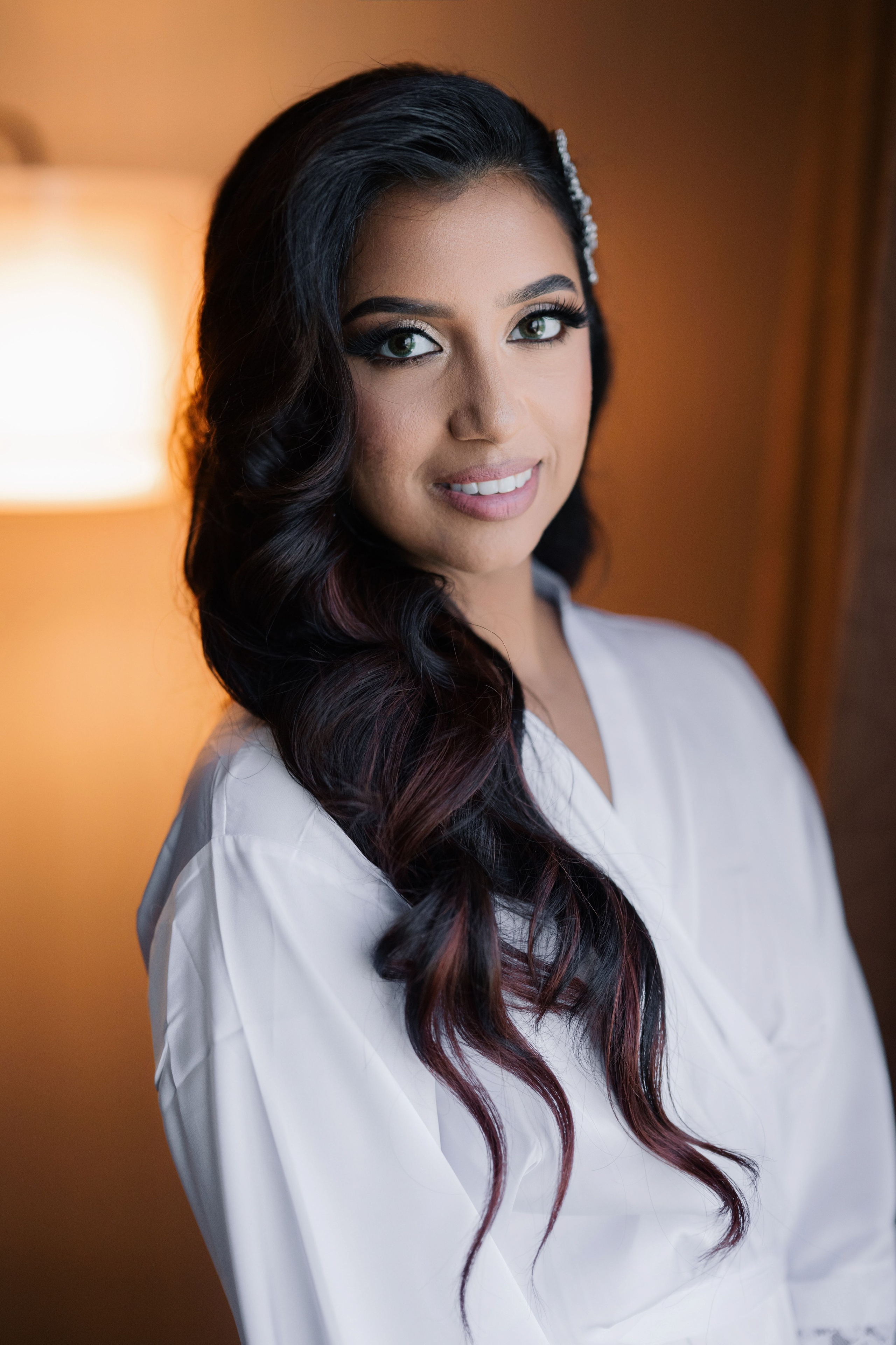a woman with long hair and a white shirt
