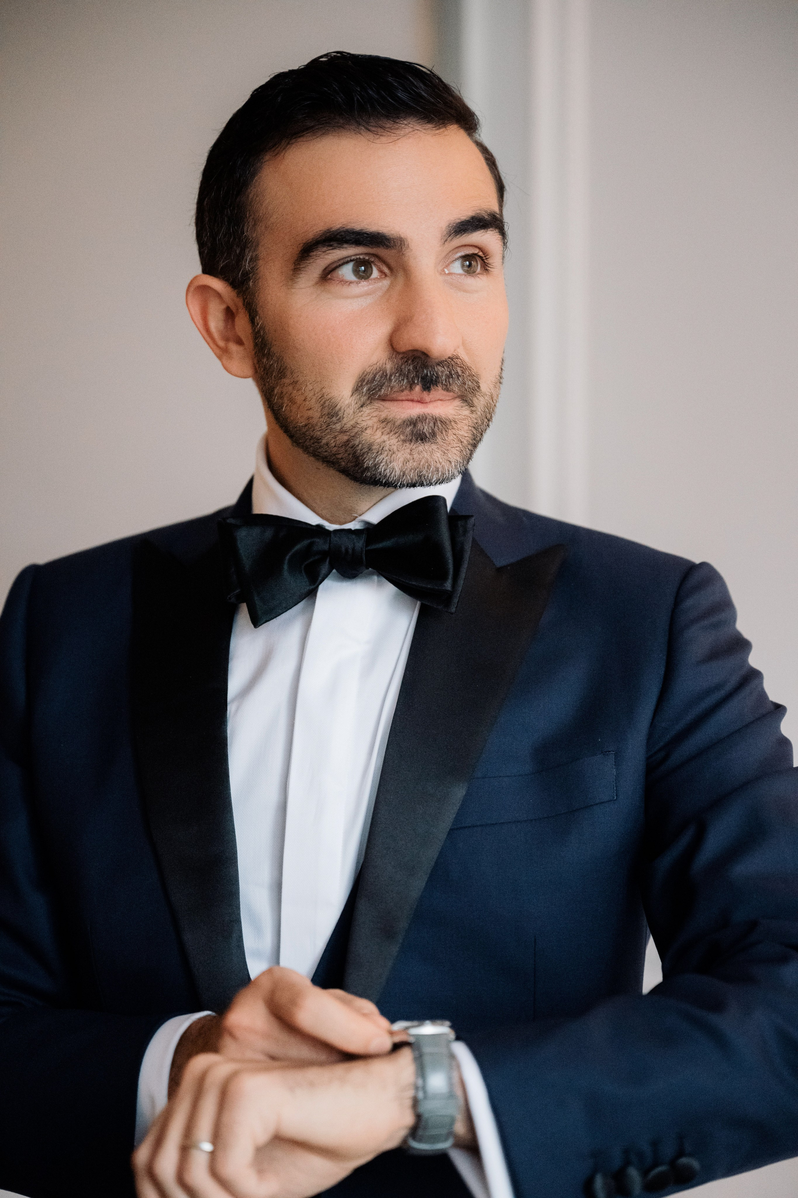 a man in a tuxed suit and bow tie