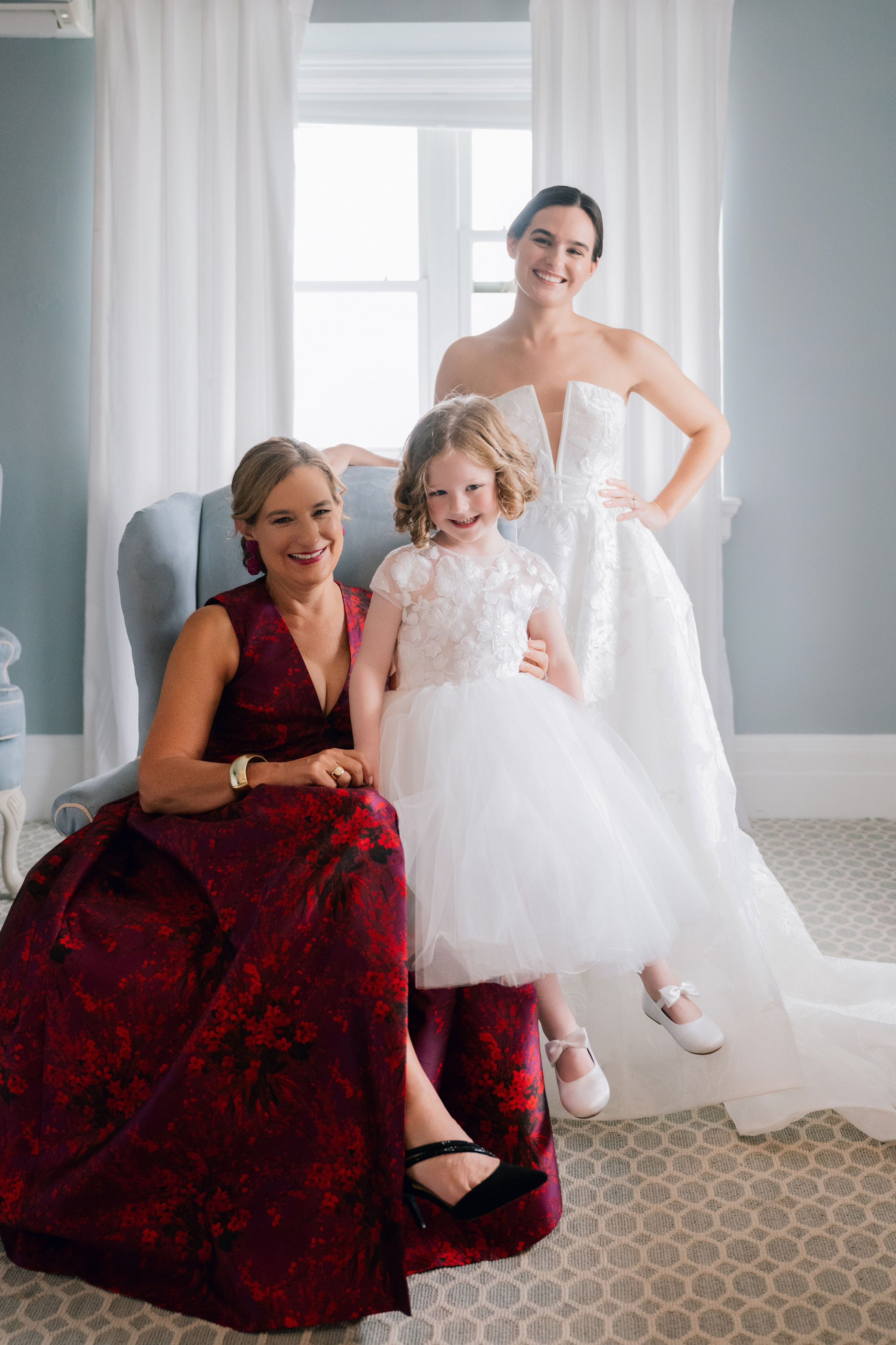 a bride and her bridesmas pose for a photo