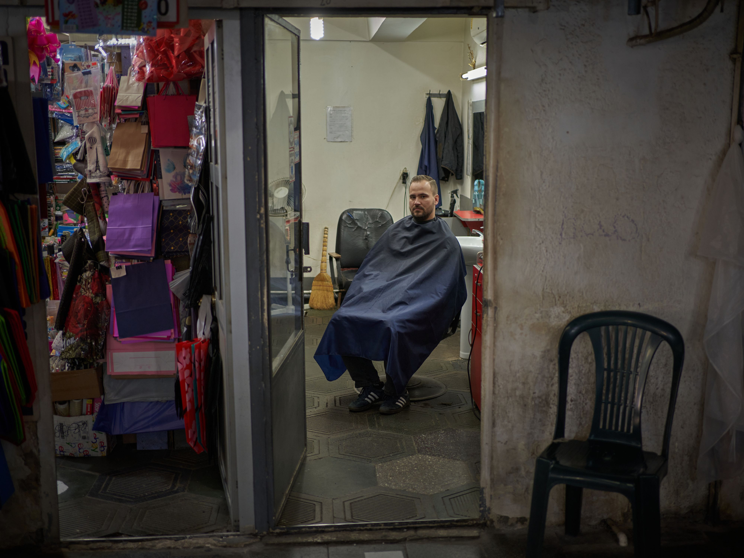 Sasha, a documentary photographer. He came to Georgia via Armenia, but a month later flew to Kazakhstan, where his family would come.