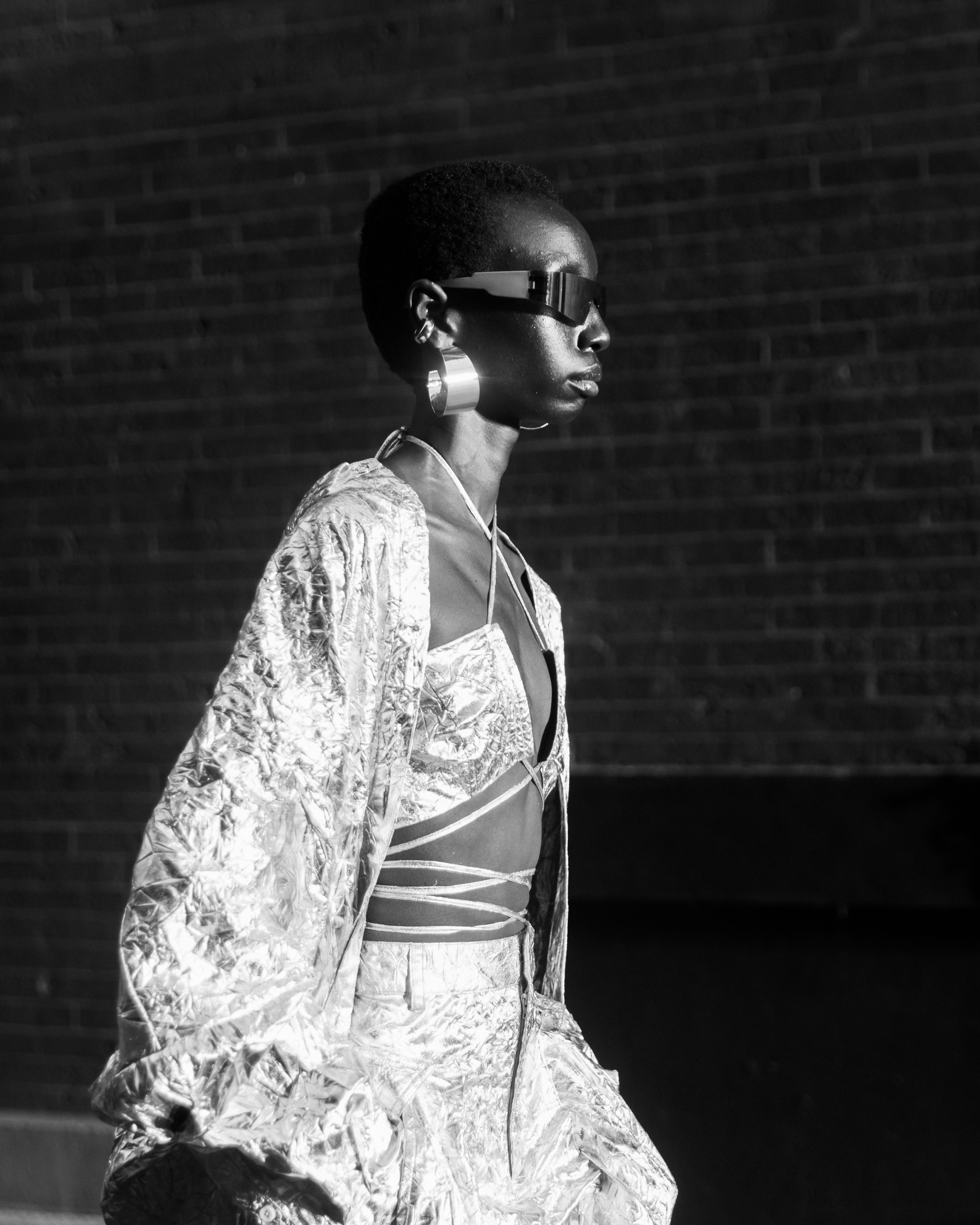 Black-and-white portrait of guest in metallic jacket – NYC event photography