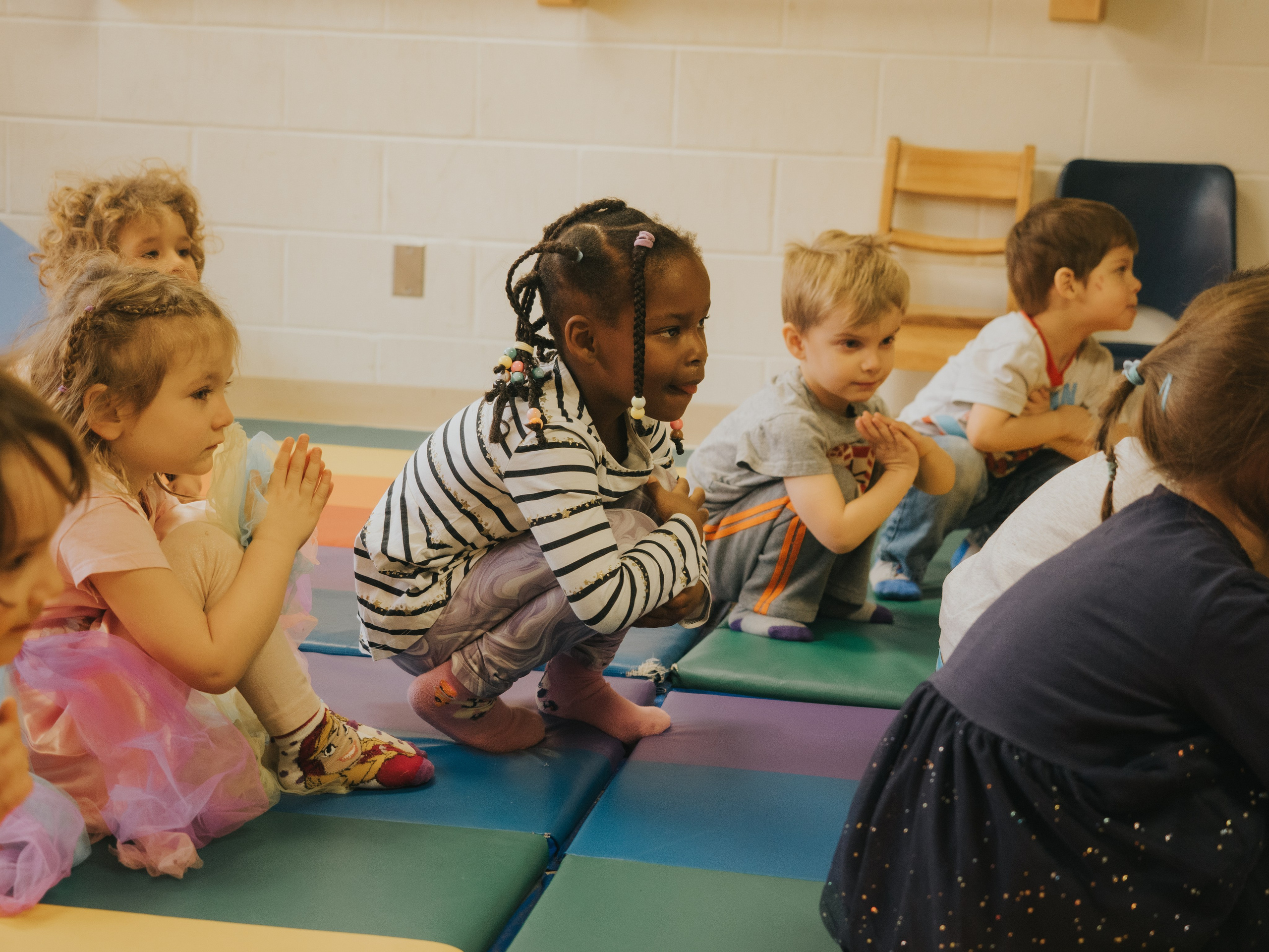 Children making dance movements.