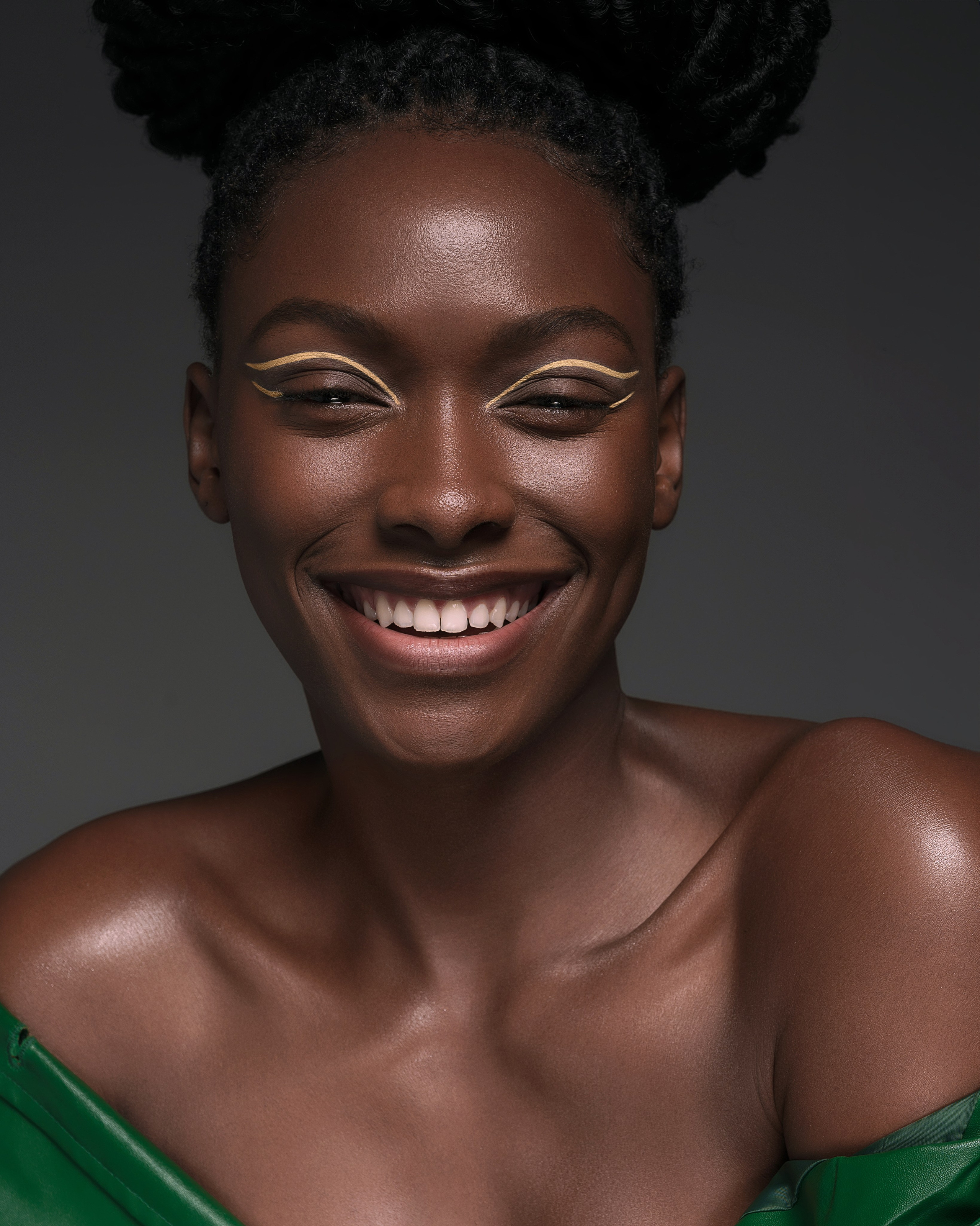 Studio close-up beauty portrait showcasing intricate eyeliner and flawless foundation with professional retouching, in San Francisco.