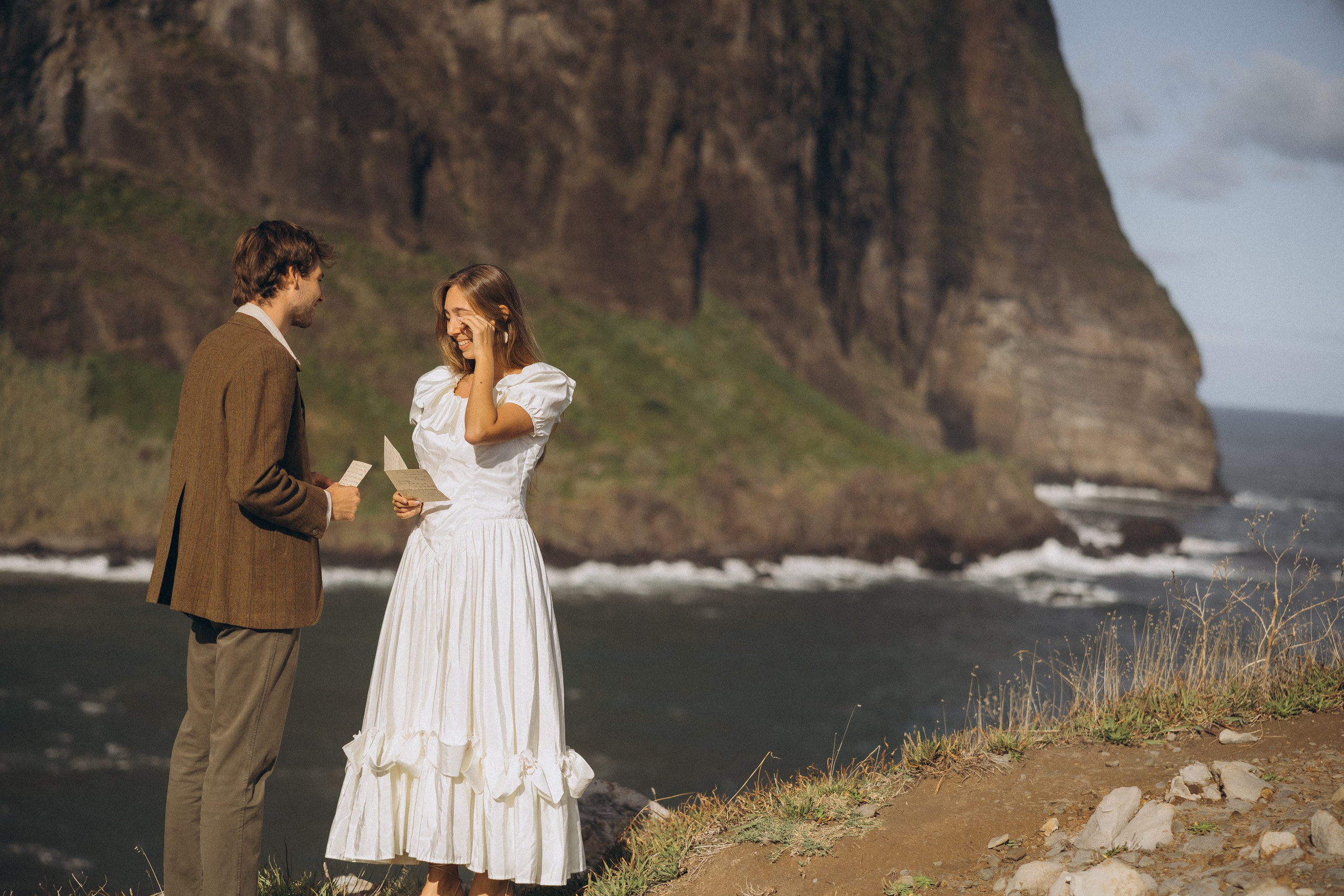 Romantic elopement in Madeira — couple exchanging vows with Atlantic Ocean views.