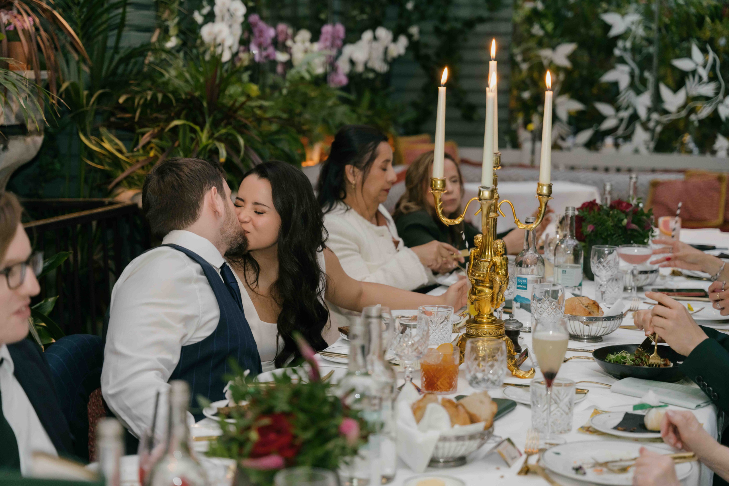 Bride and groom at The Ivy reception, natural candid moment, documentary wedding style
