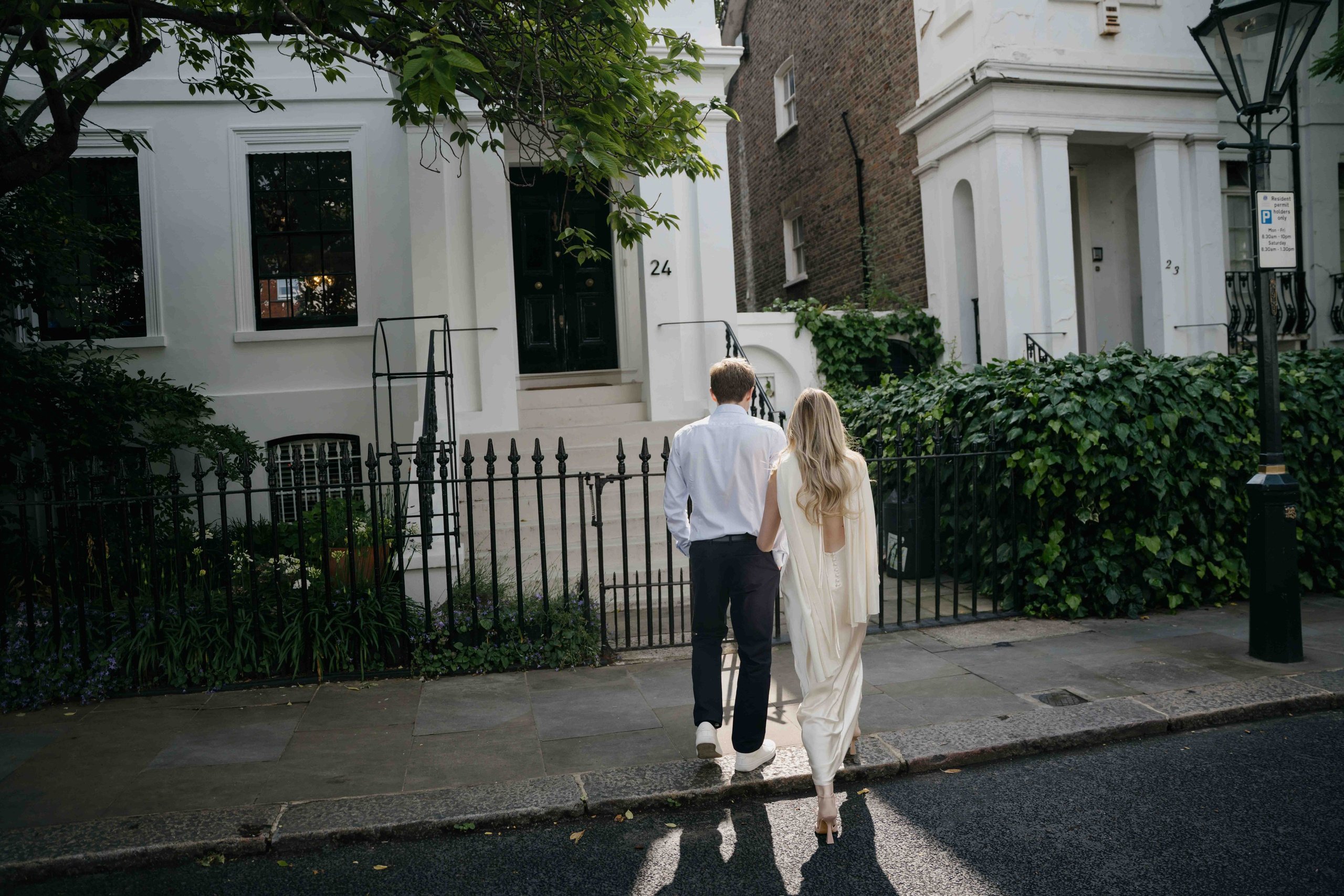 Couple walking away together on a London street in South Kensington engagement session