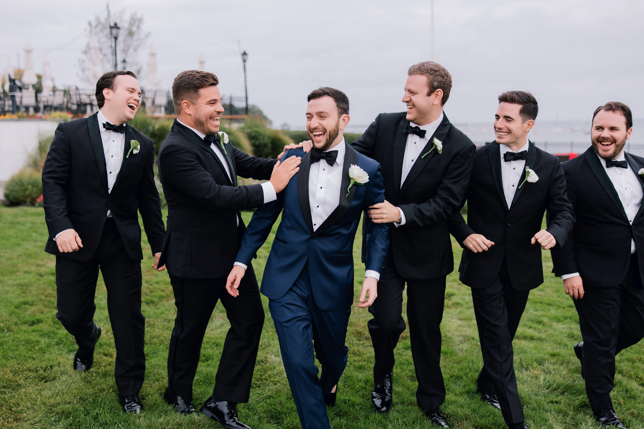 grooms laughing and laughing together