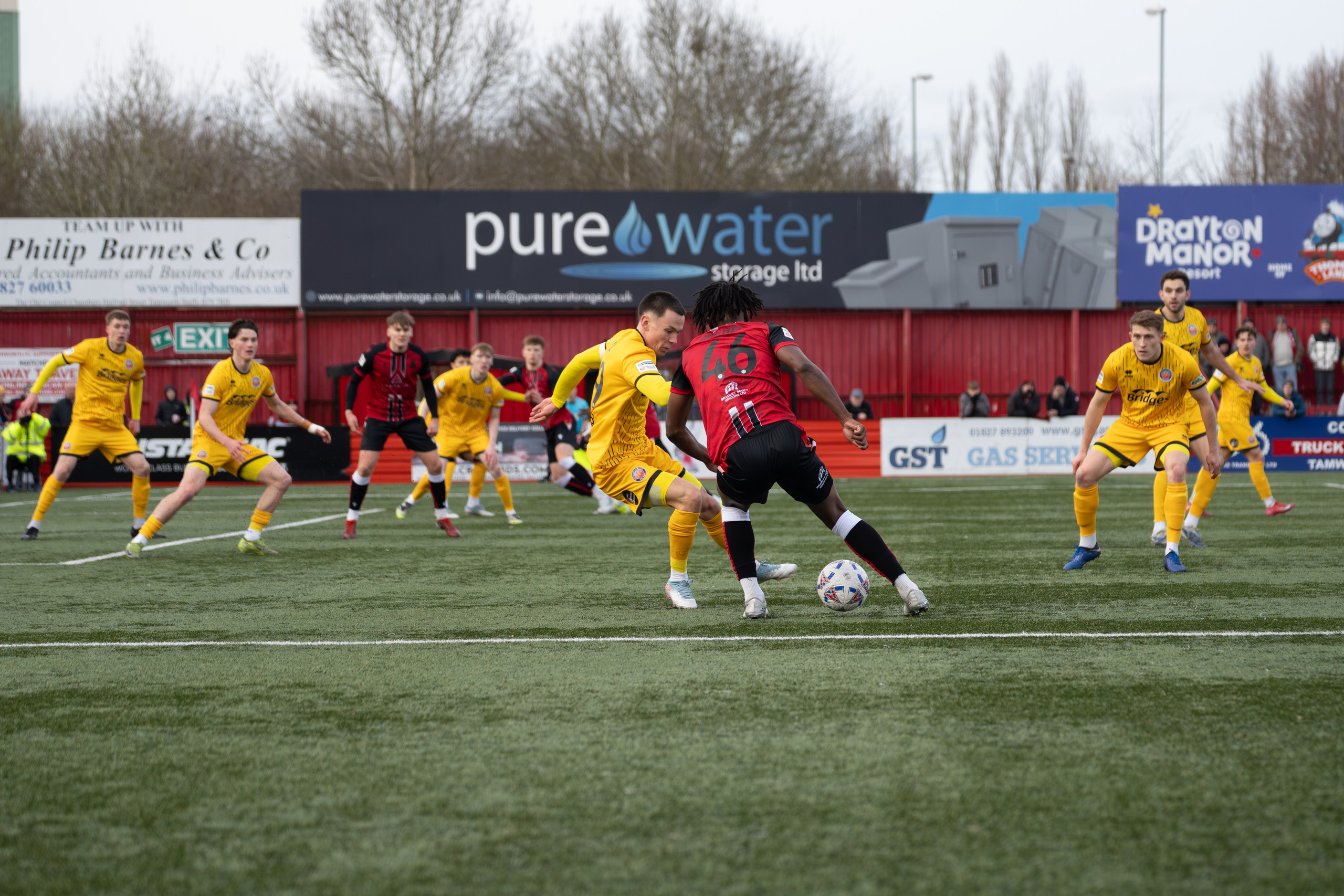 Tamworth, England — February 14, 2026: Tamworth’s Daniel Isichei shields the ball from an Aldershot Town challenge during the Enterprise National League match between Tamworth and Aldershot Town at The Lamb Ground. Photo: Jay Soundo