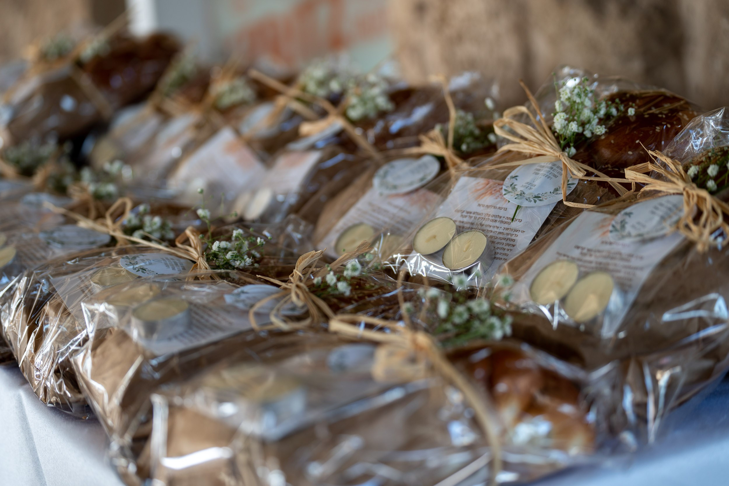 Wrapped challah loaves prepared for the wedding celebration