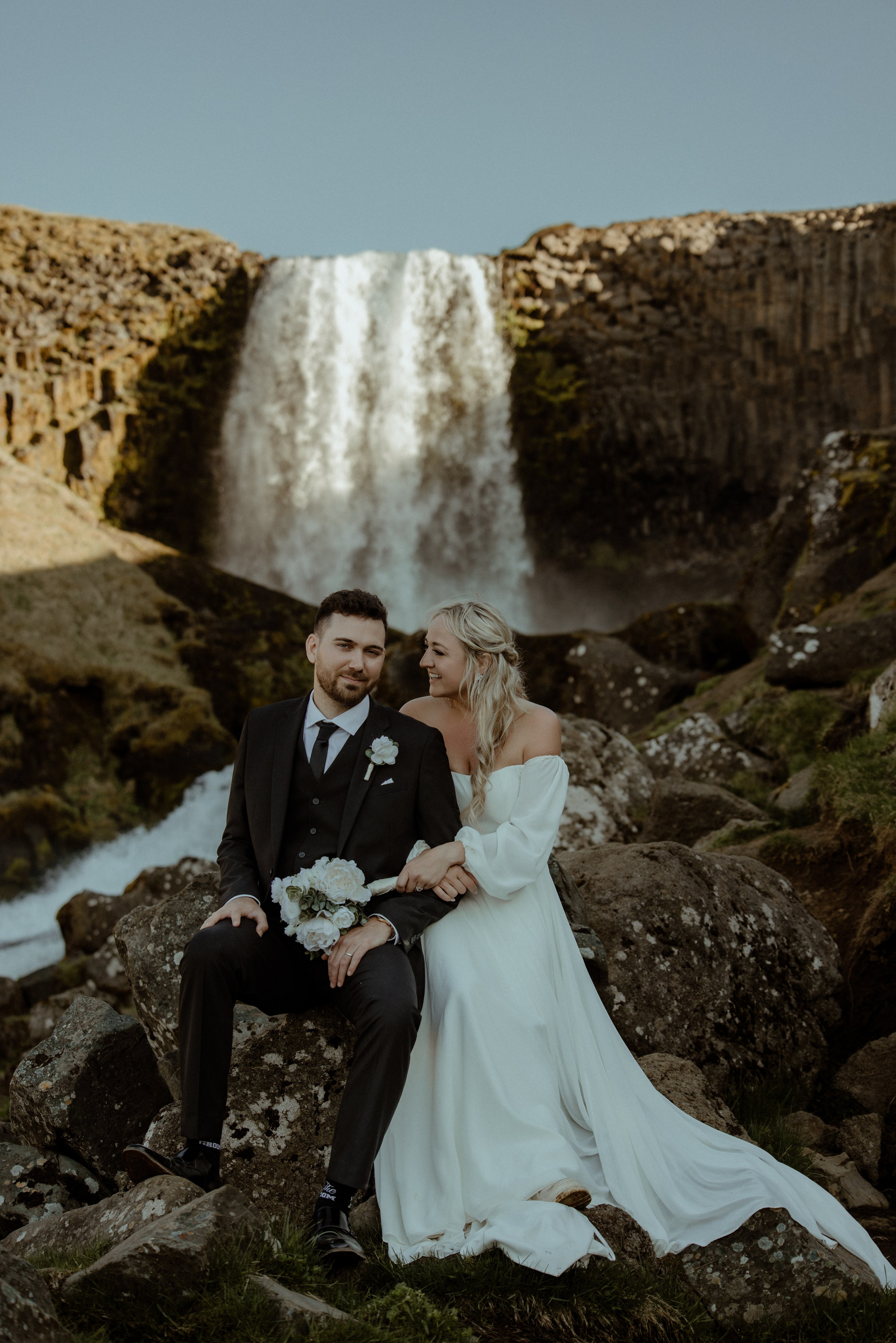 Iceland elopement at Budir with midnight sun wedding photos at black sand beach. Iceland elopement photographer & videographer