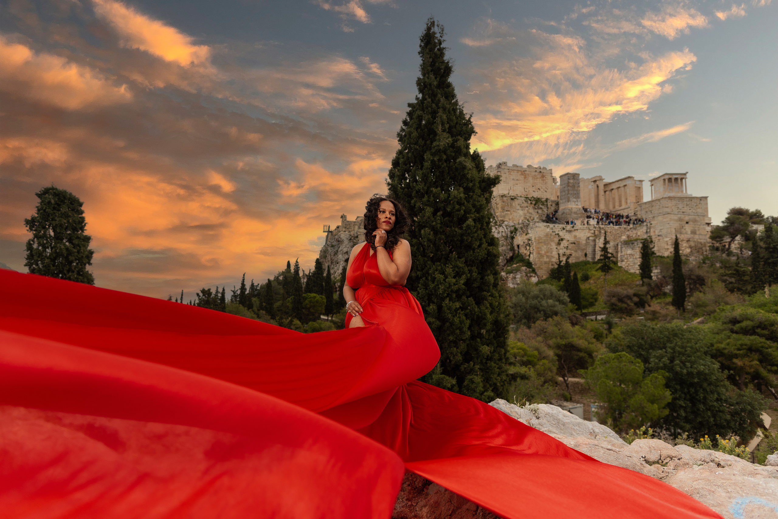 Girl in the background of the pantheon in a red flying dress