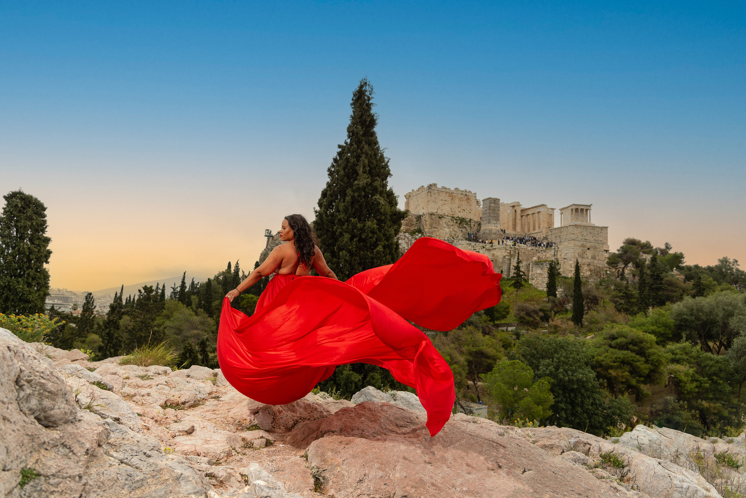 Girl in the background of the pantheon in a red flying dress