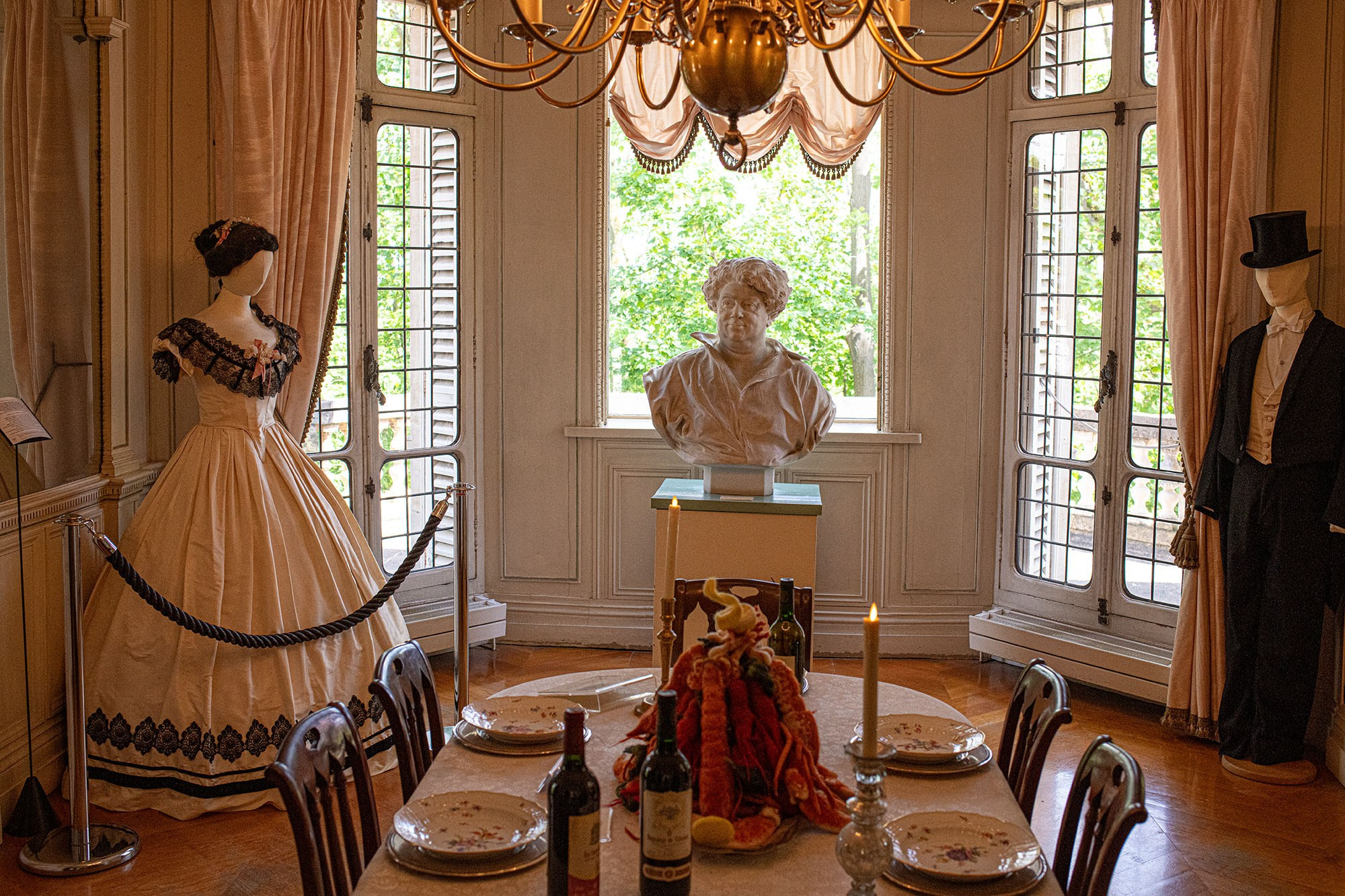 Historic dining room with Alexandre Dumas bust inside Château de Monte-Cristo near Paris