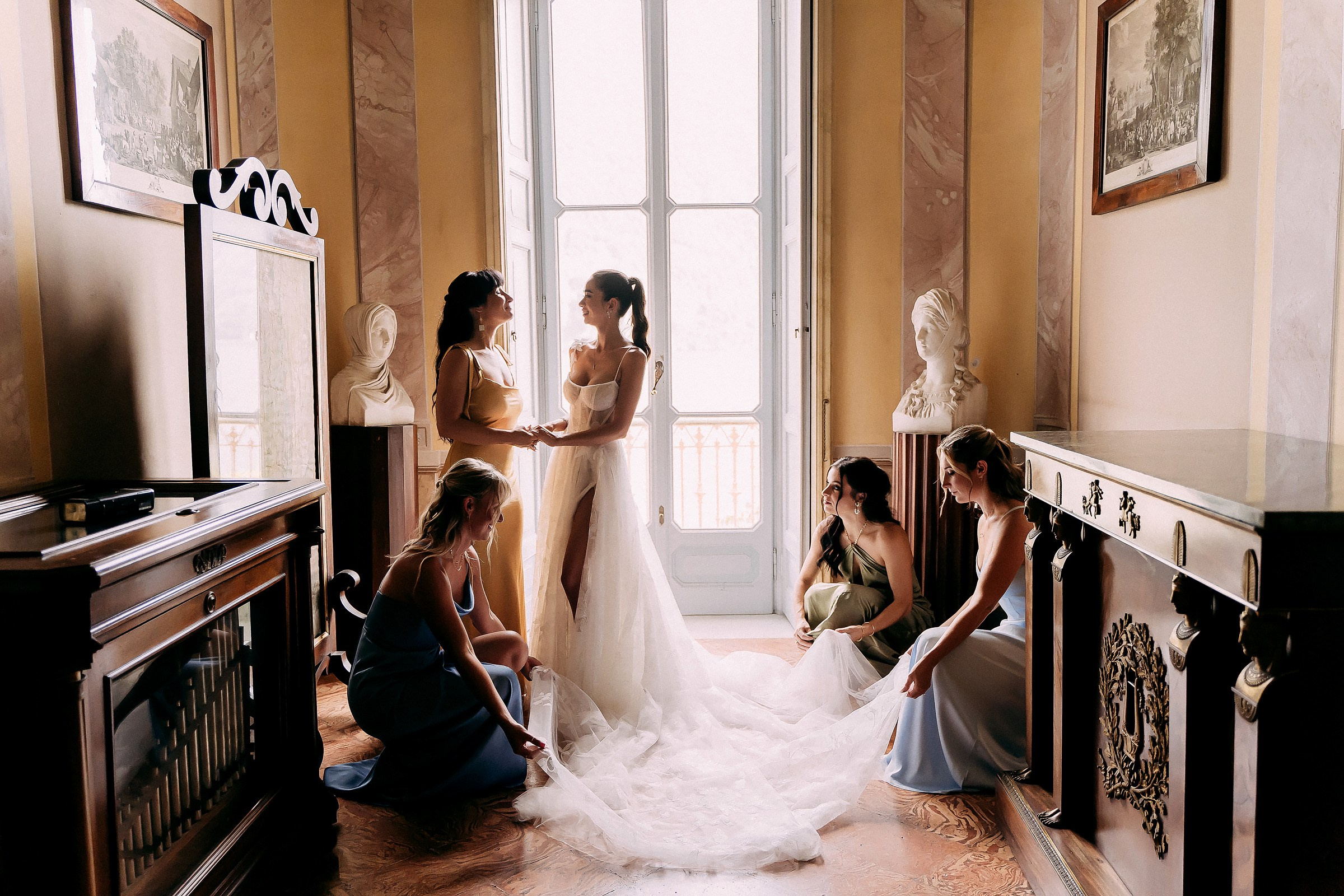 A bride and her bridesmaids are joyfully preparing for the wedding, surrounded by elegant decorations.