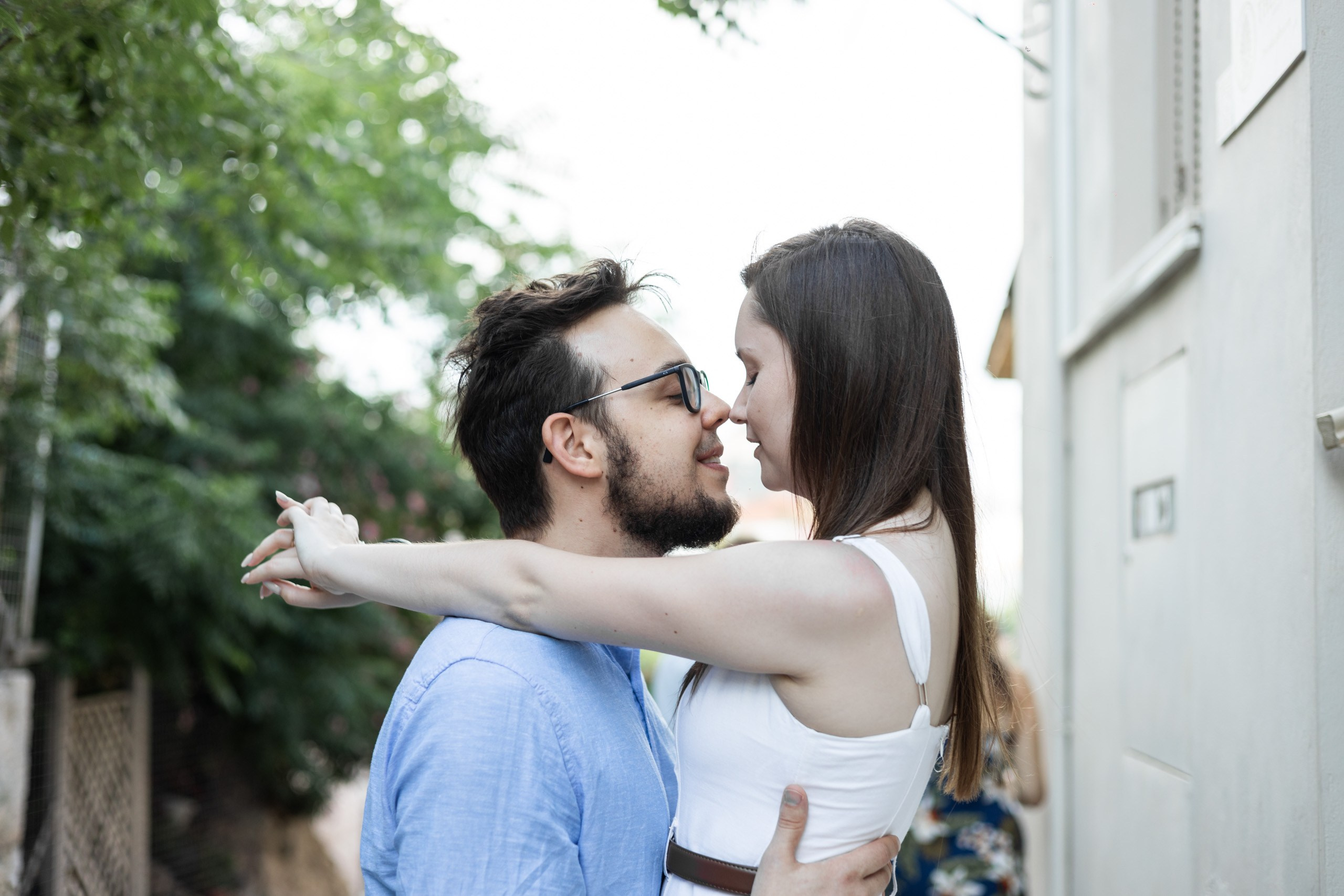 Couple sharing a kiss in the streets of Athens