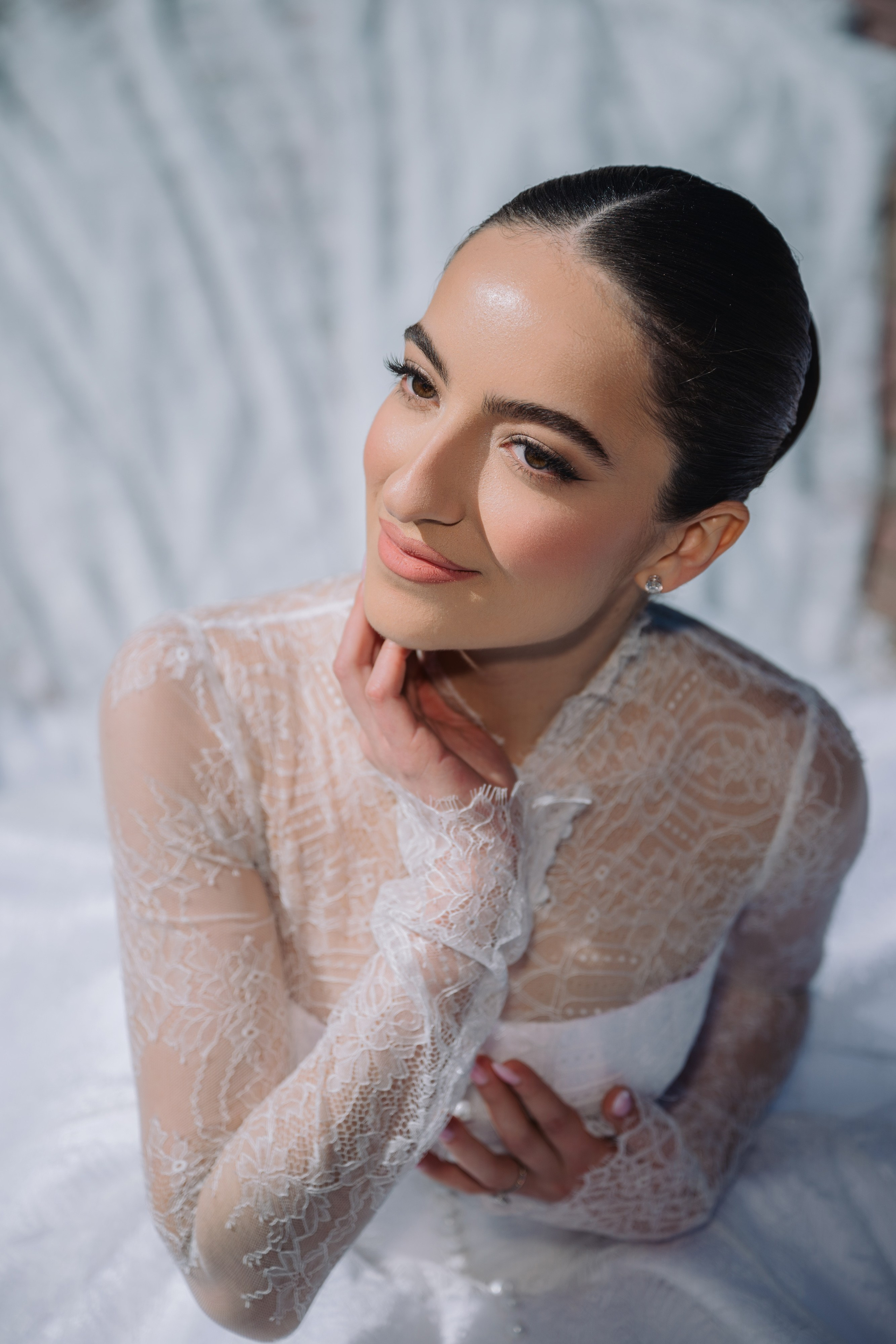 a woman in a white dress posing for a photo