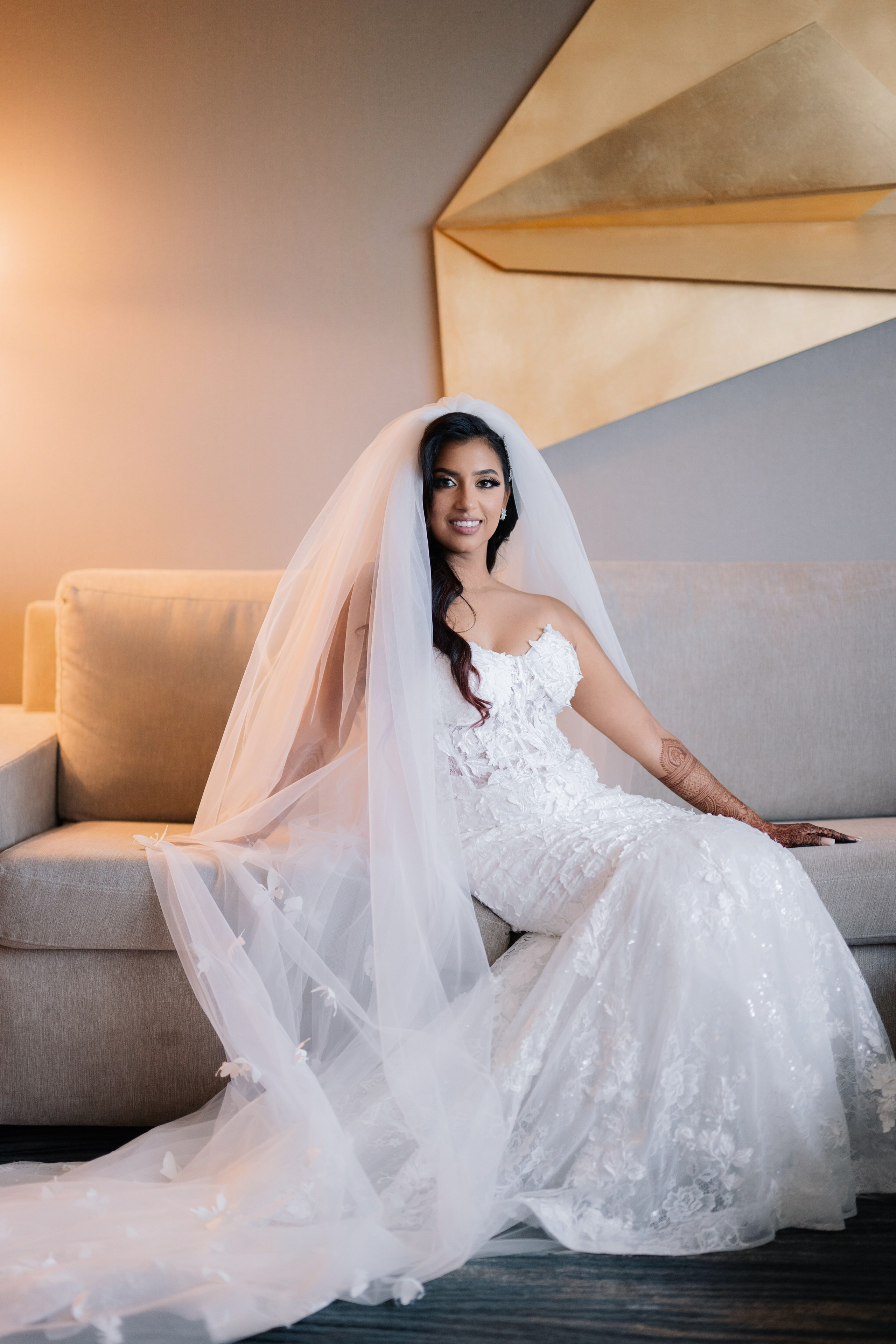 a bride sitting on a couch in a room