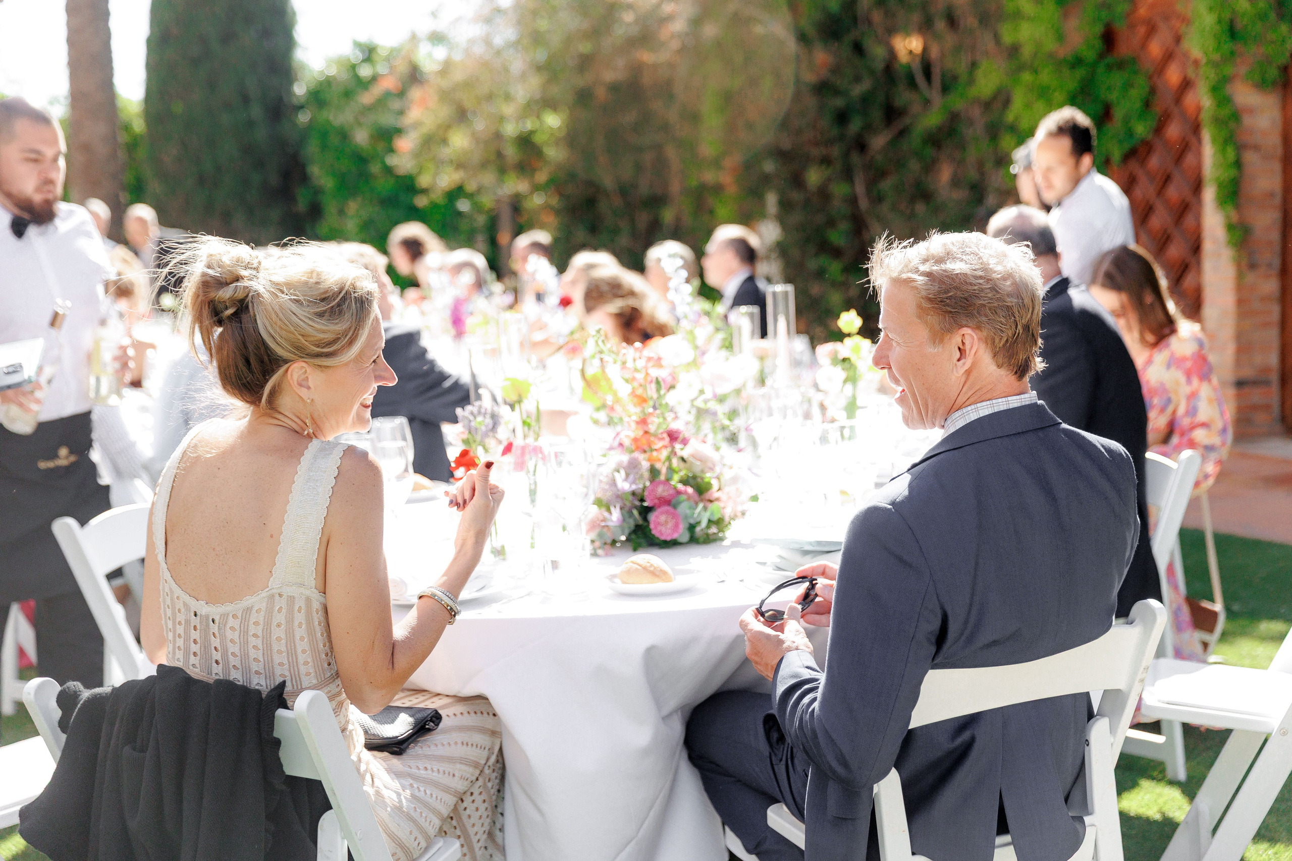 Guests are enjoying the wedding dinner at the amazing wedding venue in Spain.
