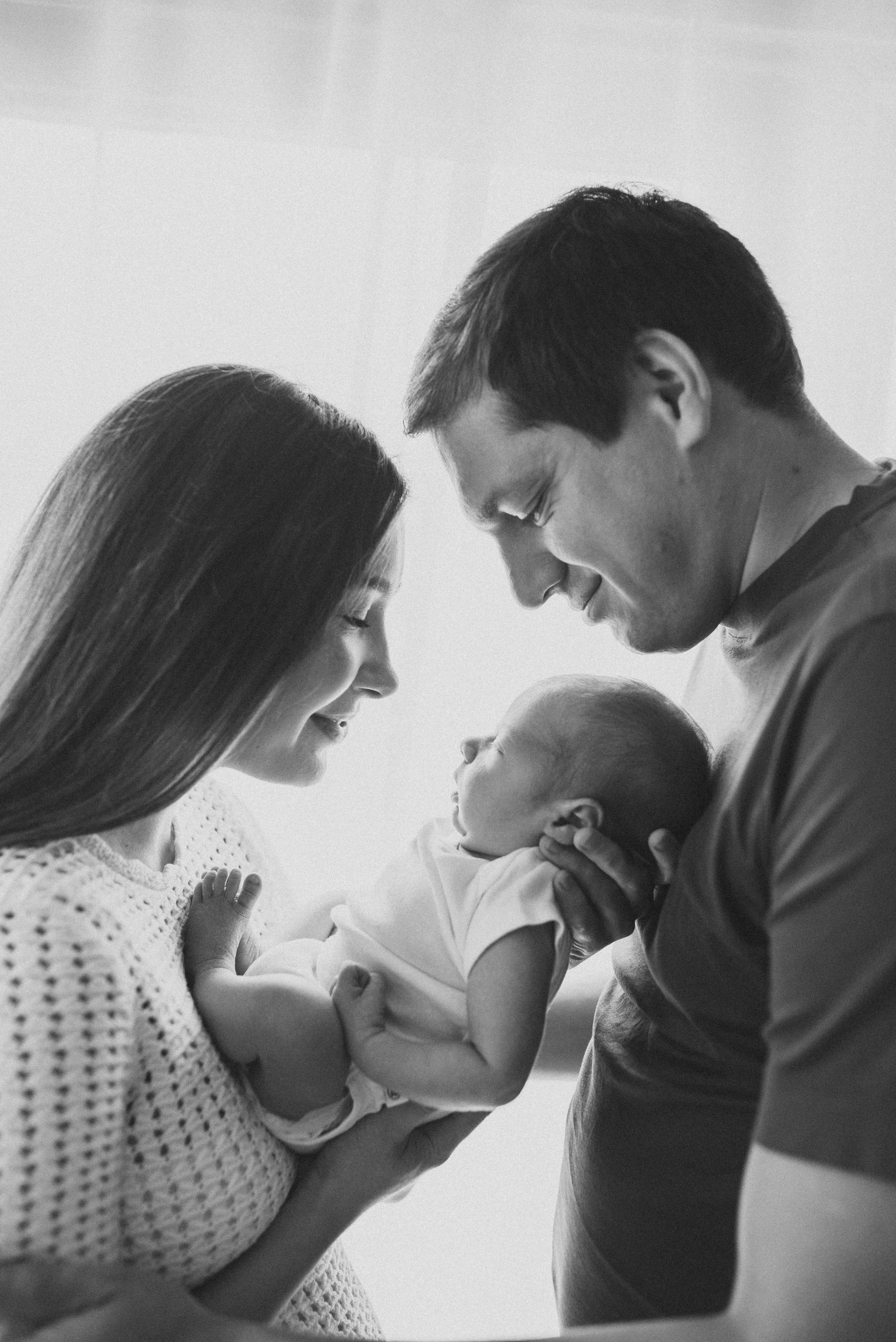 mom and dad with a newborn son