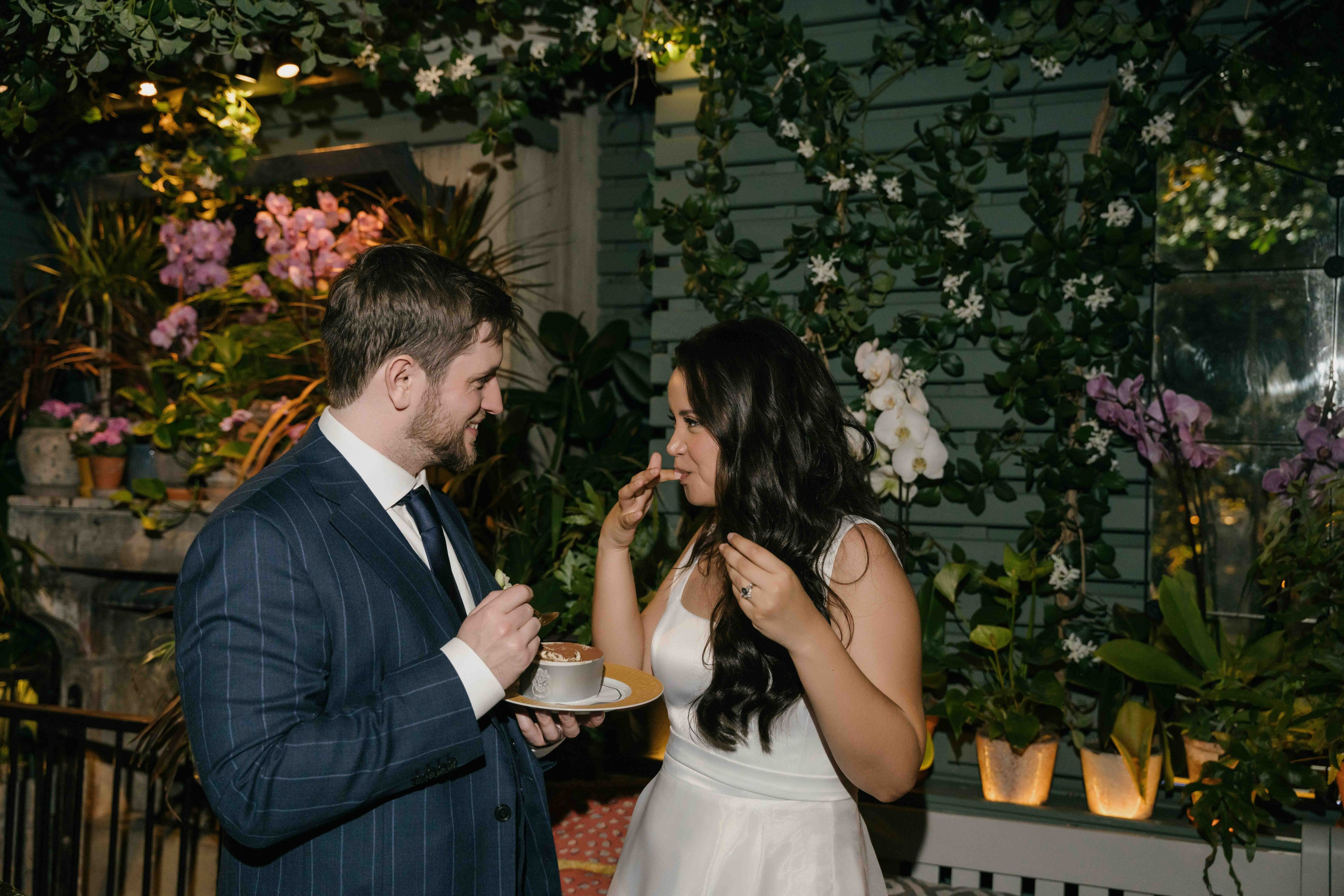 Wedding cake moment at The Ivy London reception, couple laughing and celebrating, natural documentary wedding photography