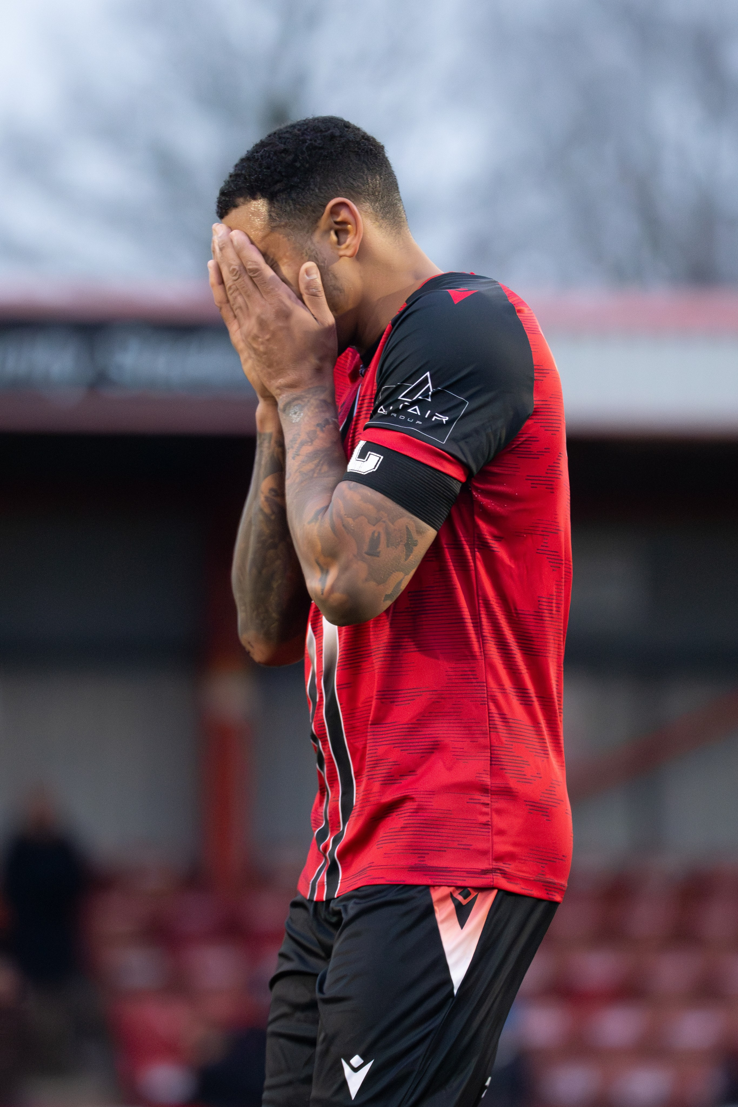 Tamworth, England — February 14, 2026: Jordan Cullinane-Liburd of Tamworth FC reacts after conceding a goal during the Enterprise National League match between Tamworth and Aldershot Town at The Lamb Ground. Photo: Jay Soundo