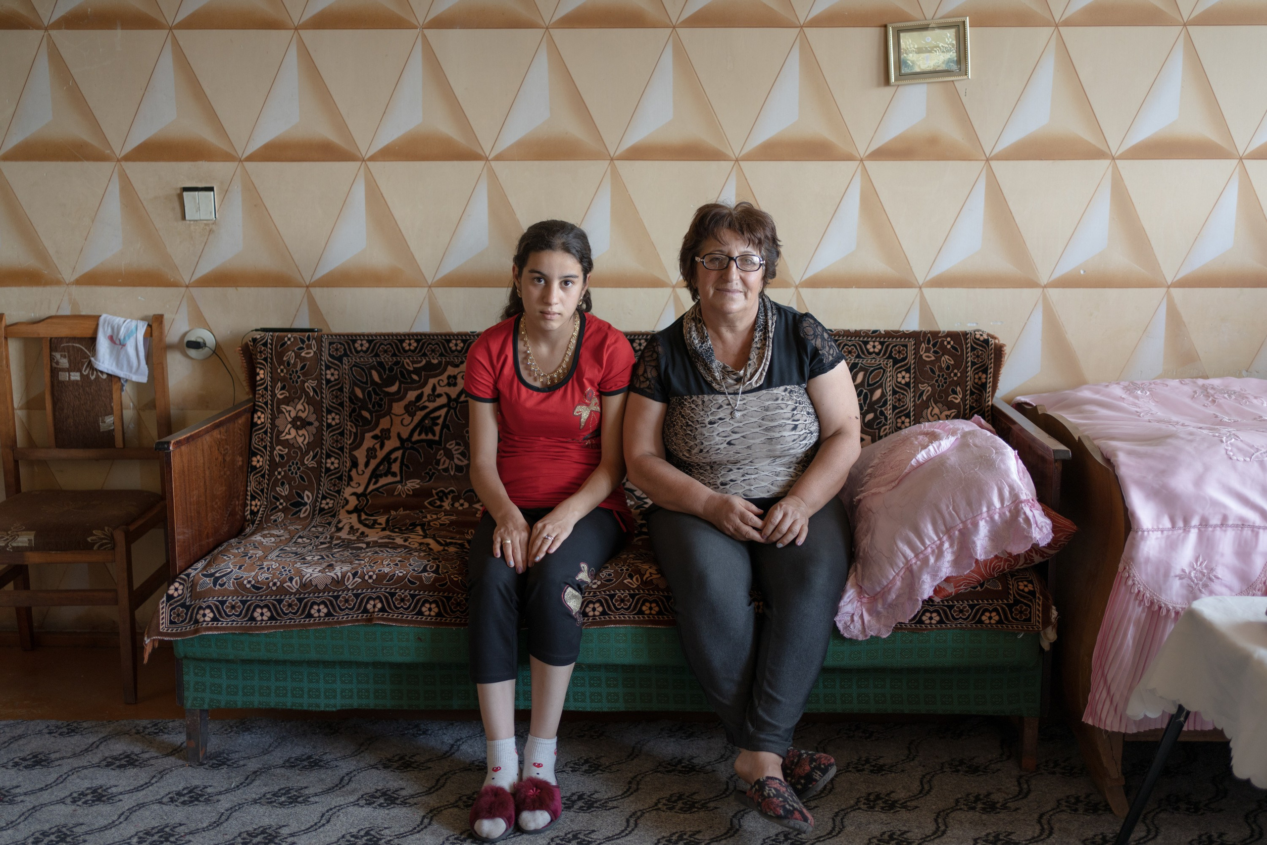 Locals of a border region of Ttujur, Armenia. Future mother-in-law (right) is posing next to her daughter-in-law (left).