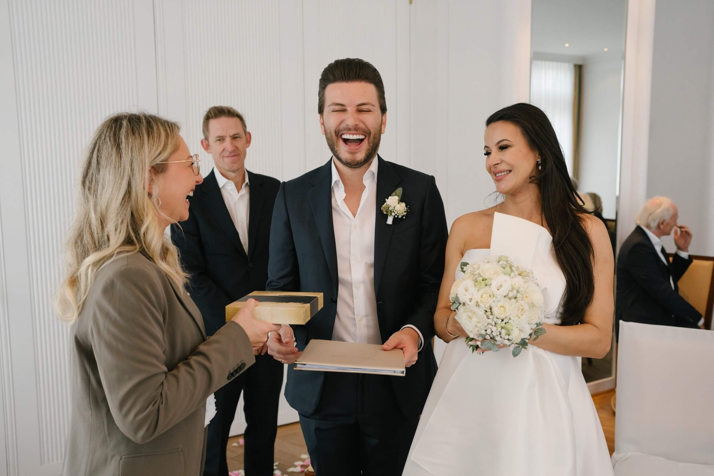 Couple receiving documents after civil ceremony at Standesamt Grünwald