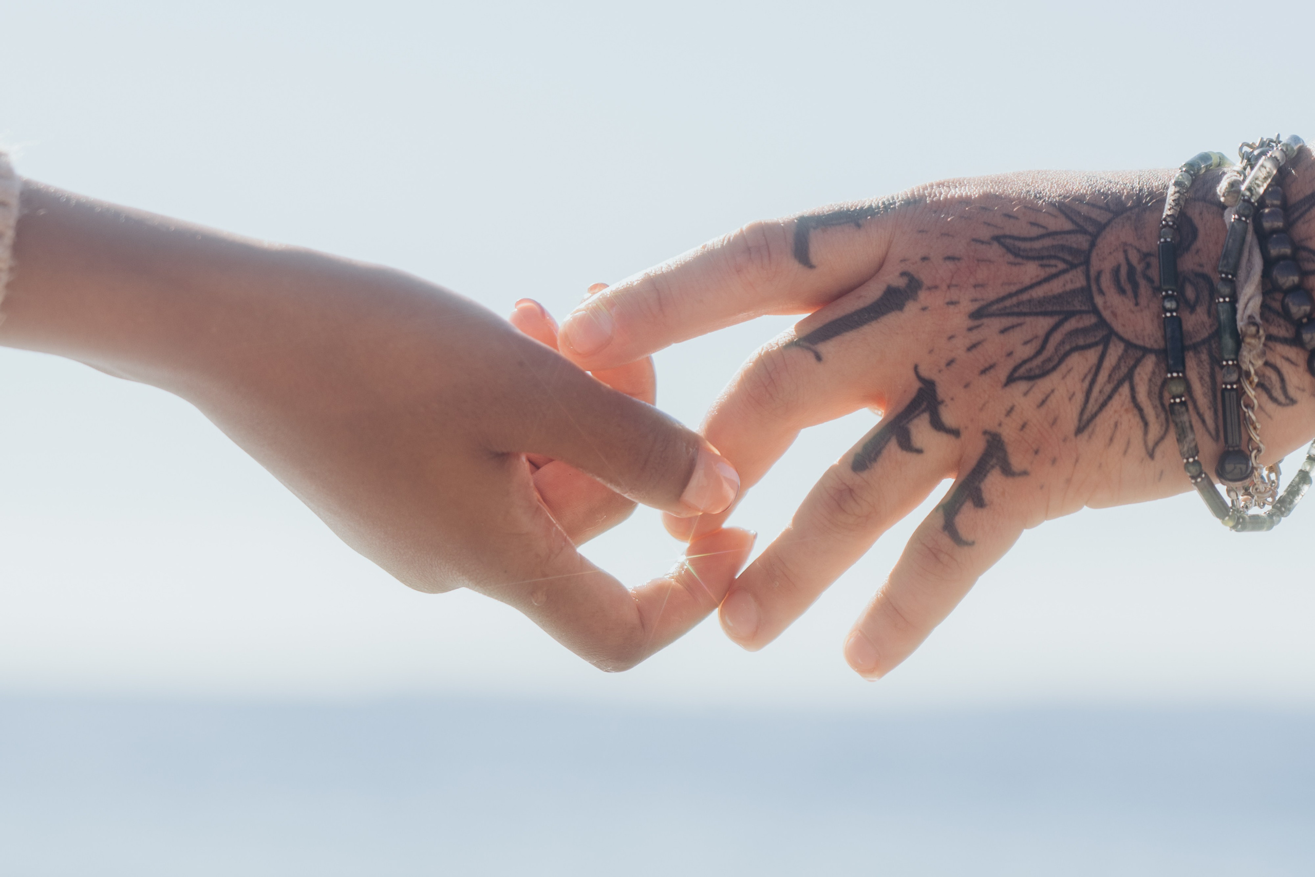 Romantic beach couple photoshoot in Connecticut. Daria Deschain Cinematic Photography in Connecticut