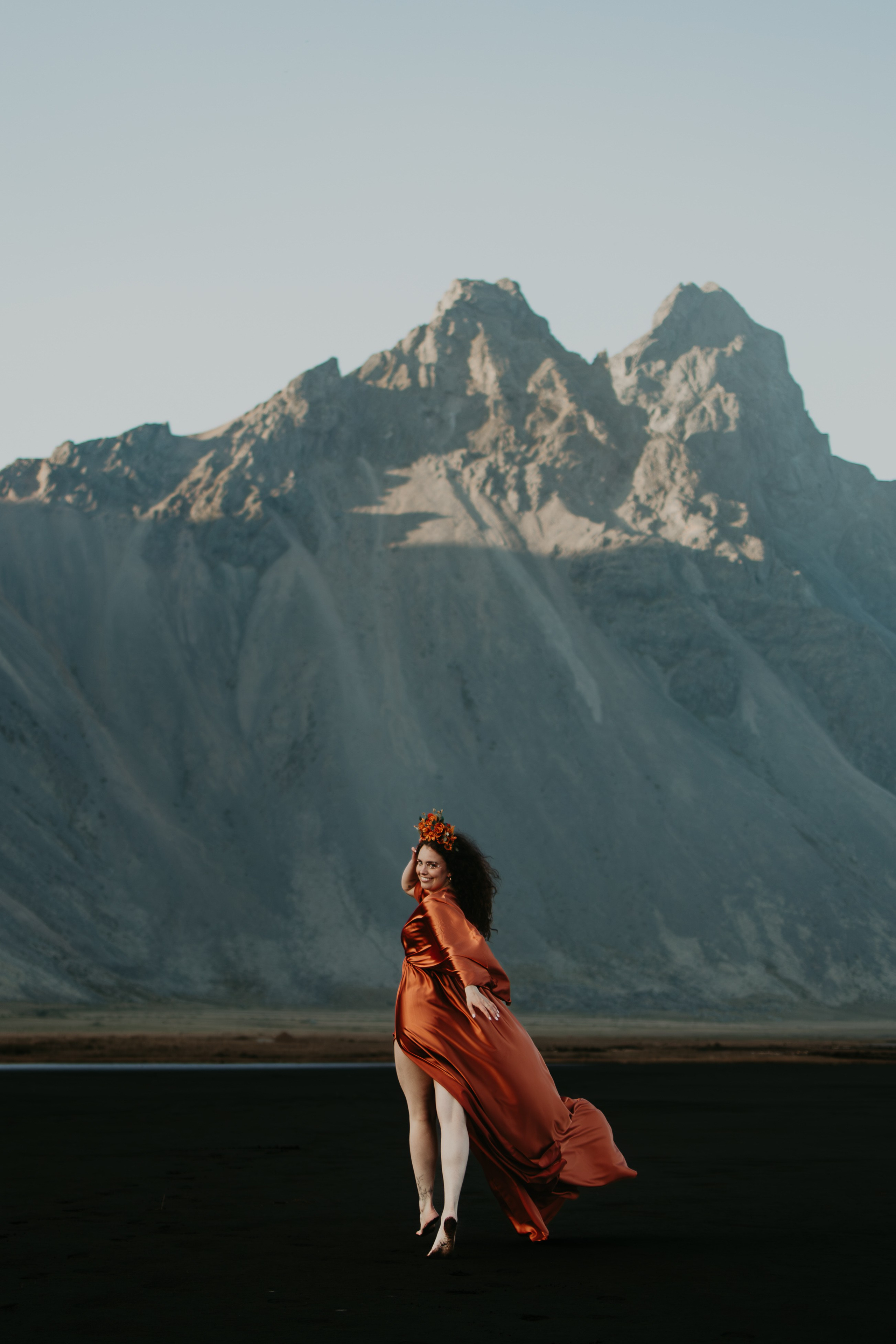 Iceland photography sessions in stunning landscapes, including waterfalls, mountains, and black sand beaches