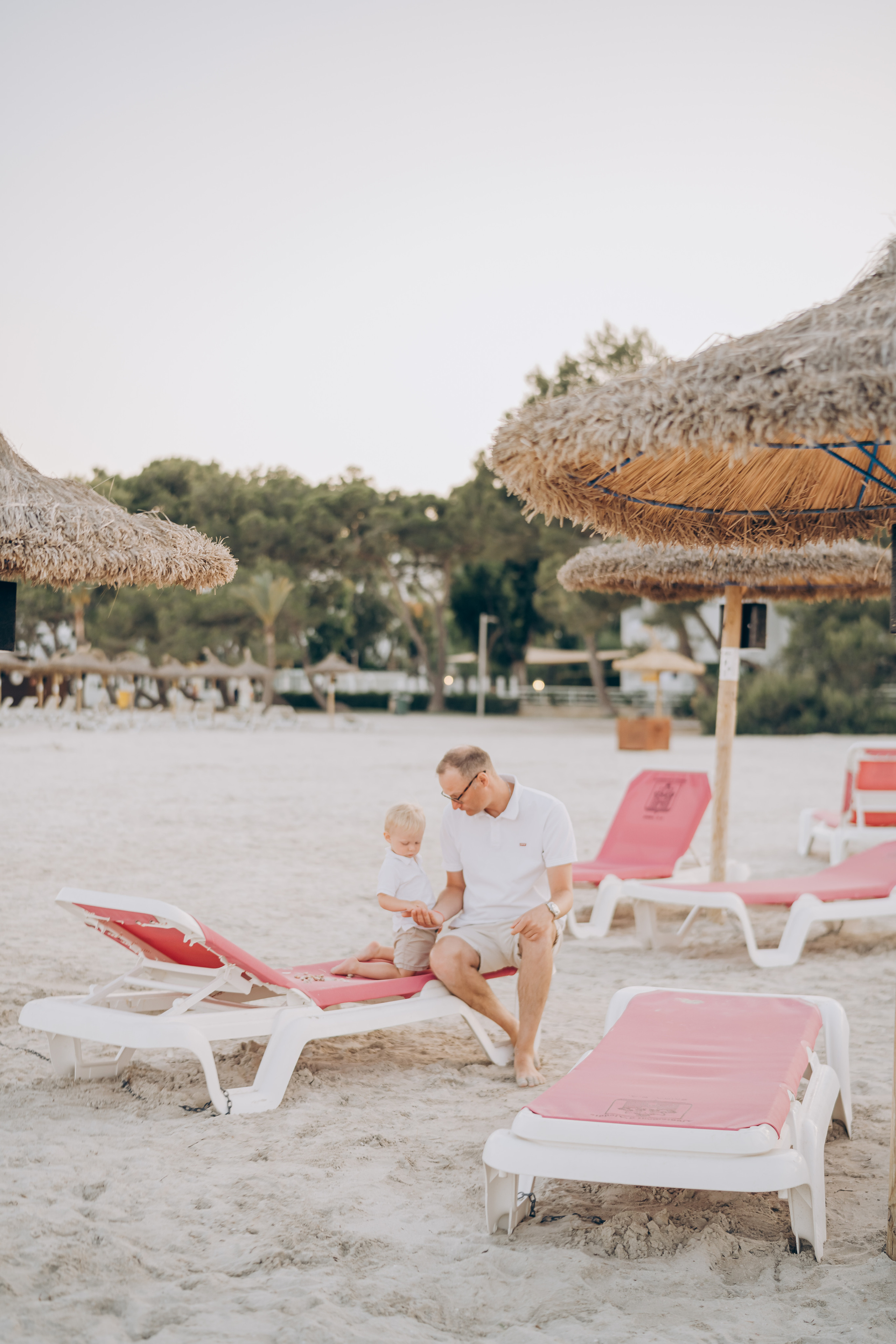 Relax, smile, and cherish: Family beach photography in Majorca's stunning coastal scenery.