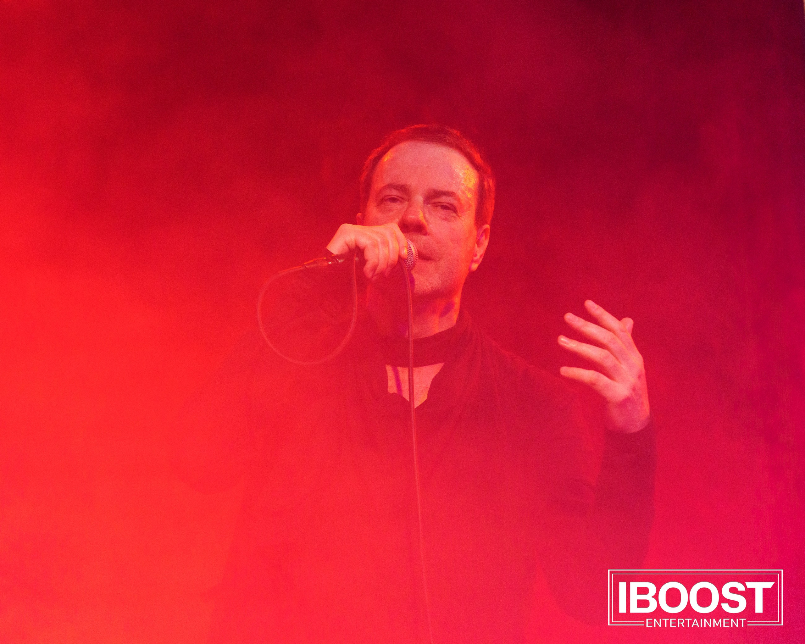 Vocalist Krasovitsky performing in intense red stage light and smoke during the Animal JazZ concert in Sofia.