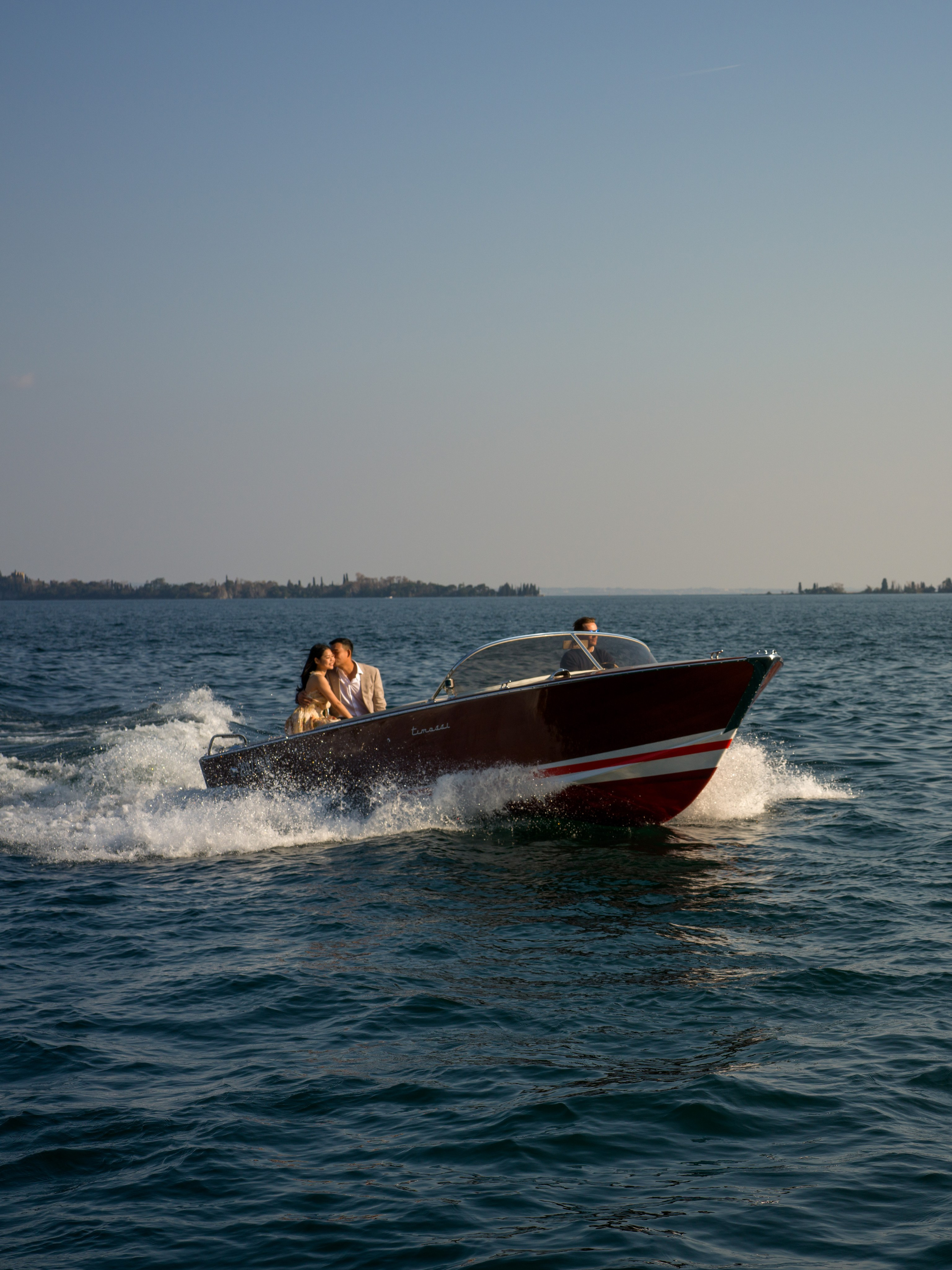 Romantic engagement at Lake Garda with Isola del Garda view.