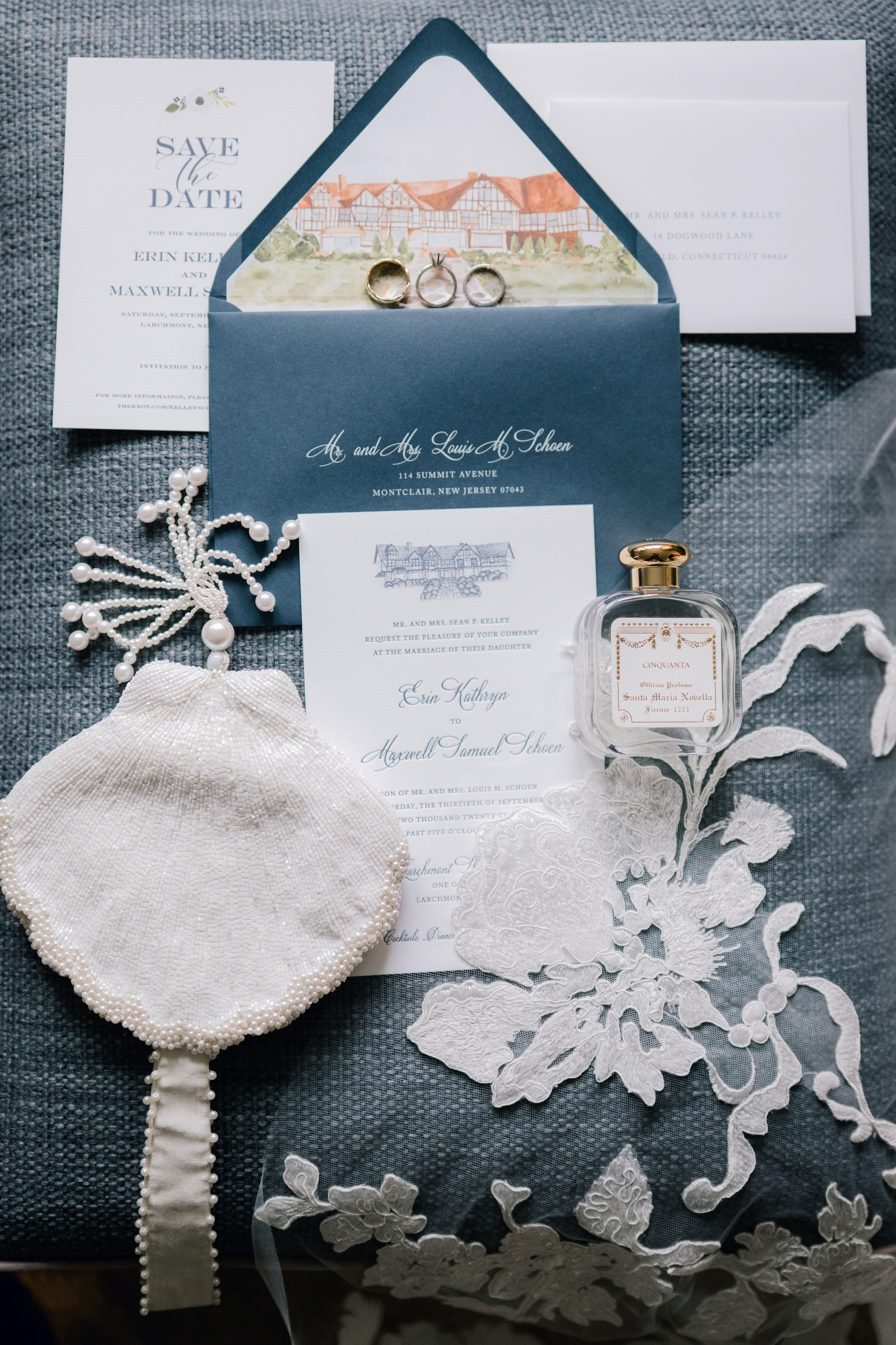 a wedding invitation with a ring and a ring on top