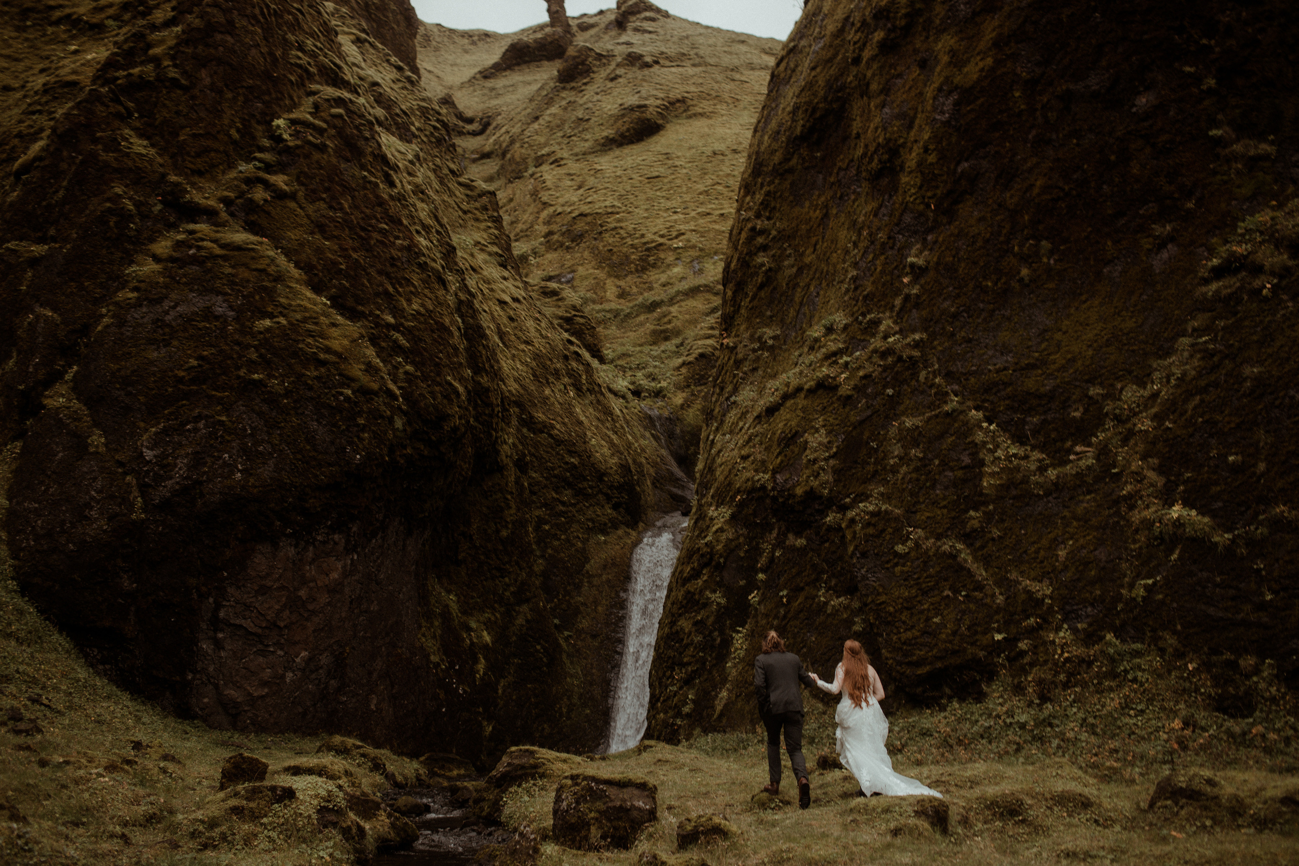 Ceremony at secret waterfall Iceland. Iceland elopement photographer & videographer