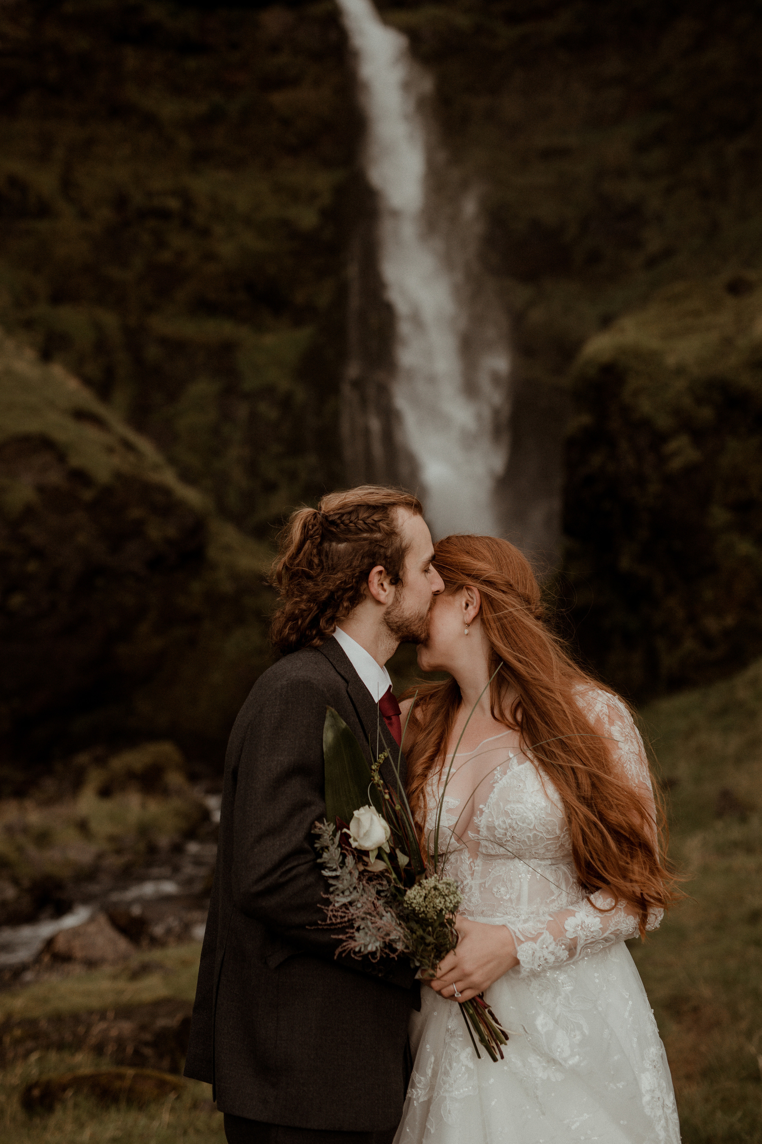 Ceremony at secret waterfall Iceland. Iceland elopement photographer & videographer