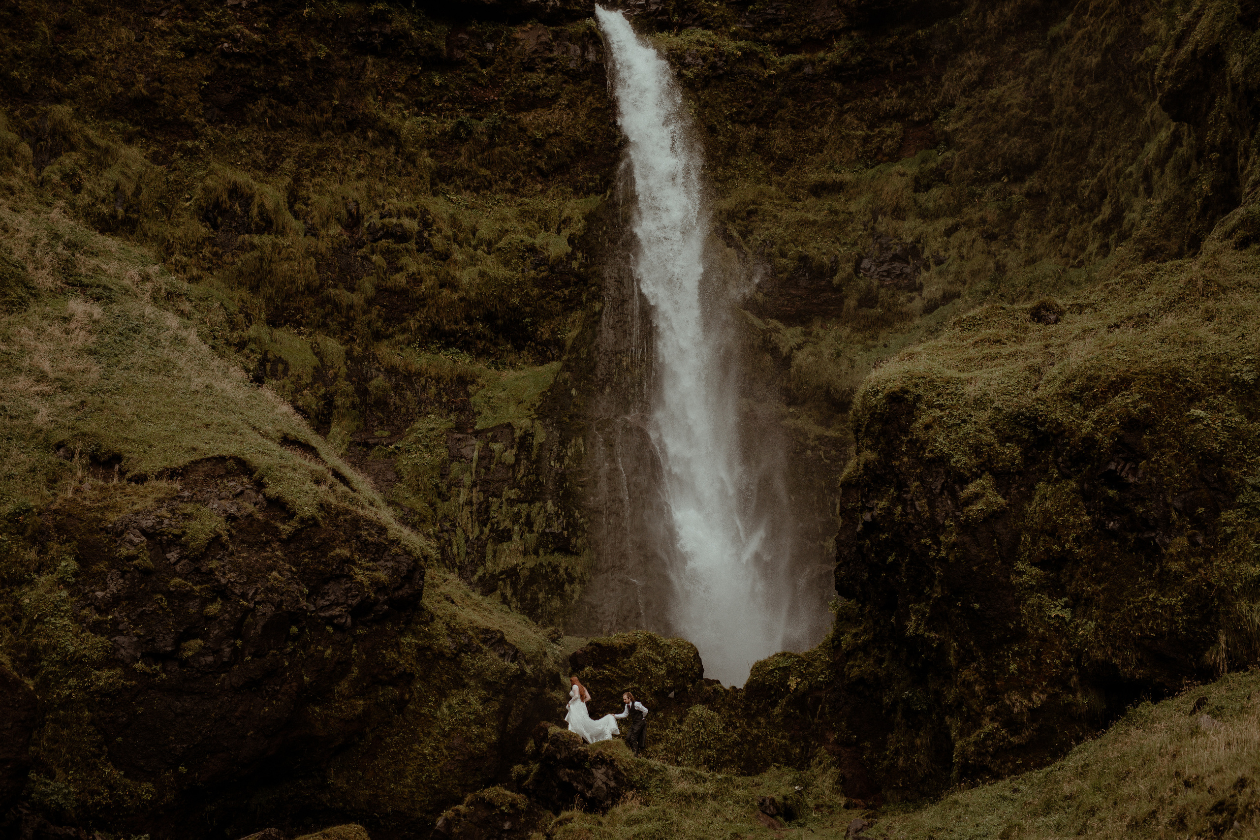 Ceremony at secret waterfall Iceland. Iceland elopement photographer & videographer