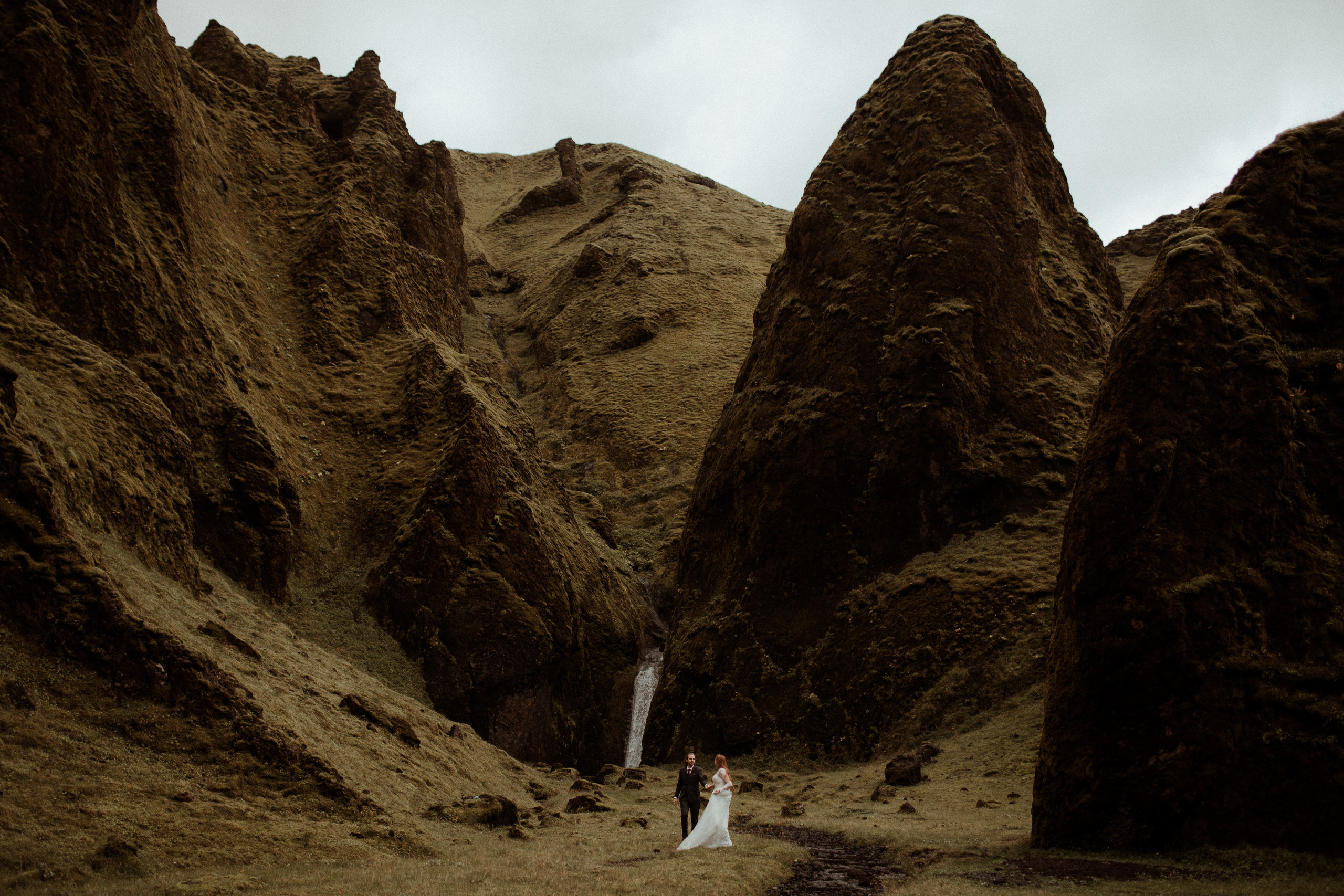 Ceremony at secret waterfall Iceland. Iceland elopement photographer & videographer