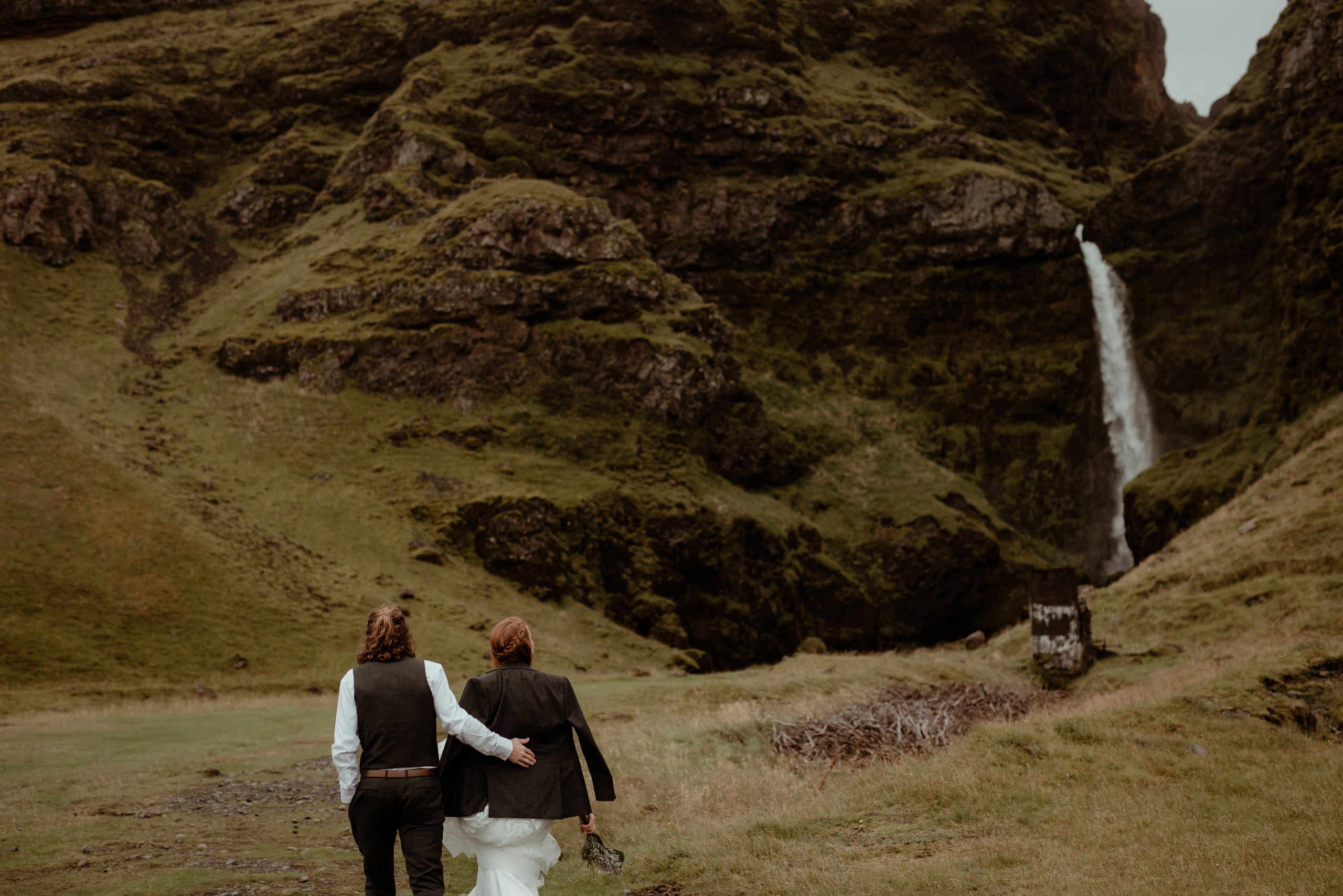 Ceremony at secret waterfall Iceland. Iceland elopement photographer & videographer