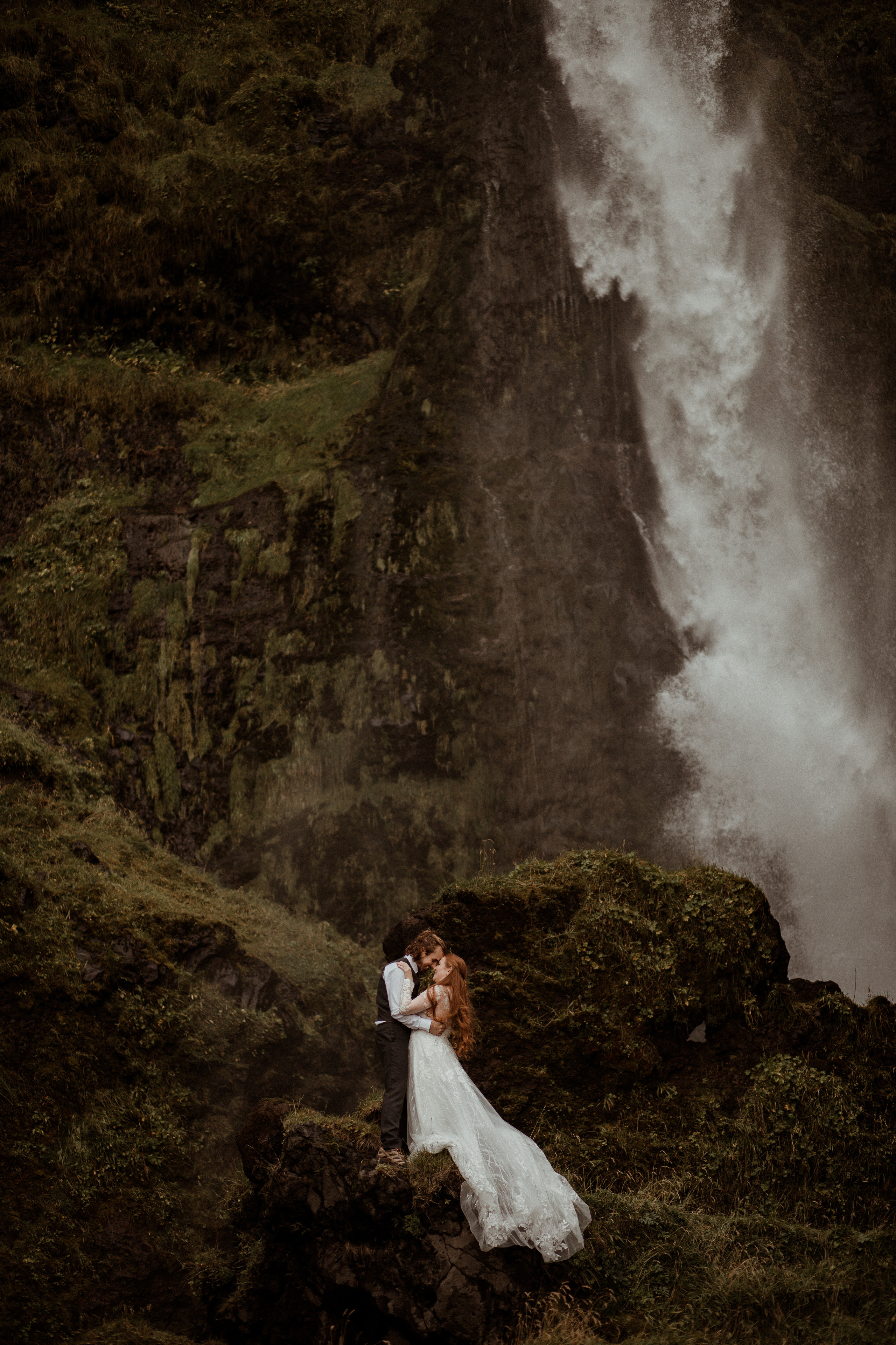 Ceremony at secret waterfall Iceland. Iceland elopement photographer & videographer