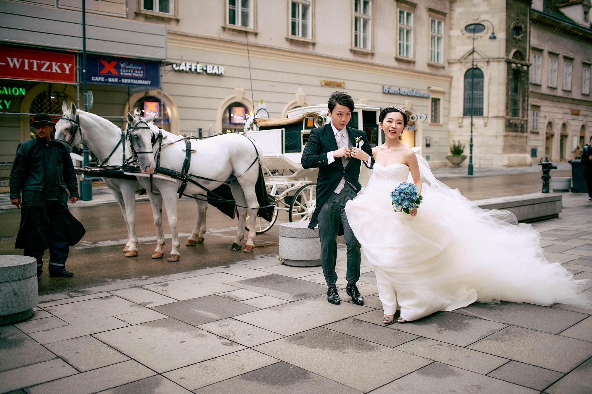 Newlyweds stepping from carriage near St. Stephen's Cathedral Vienna.