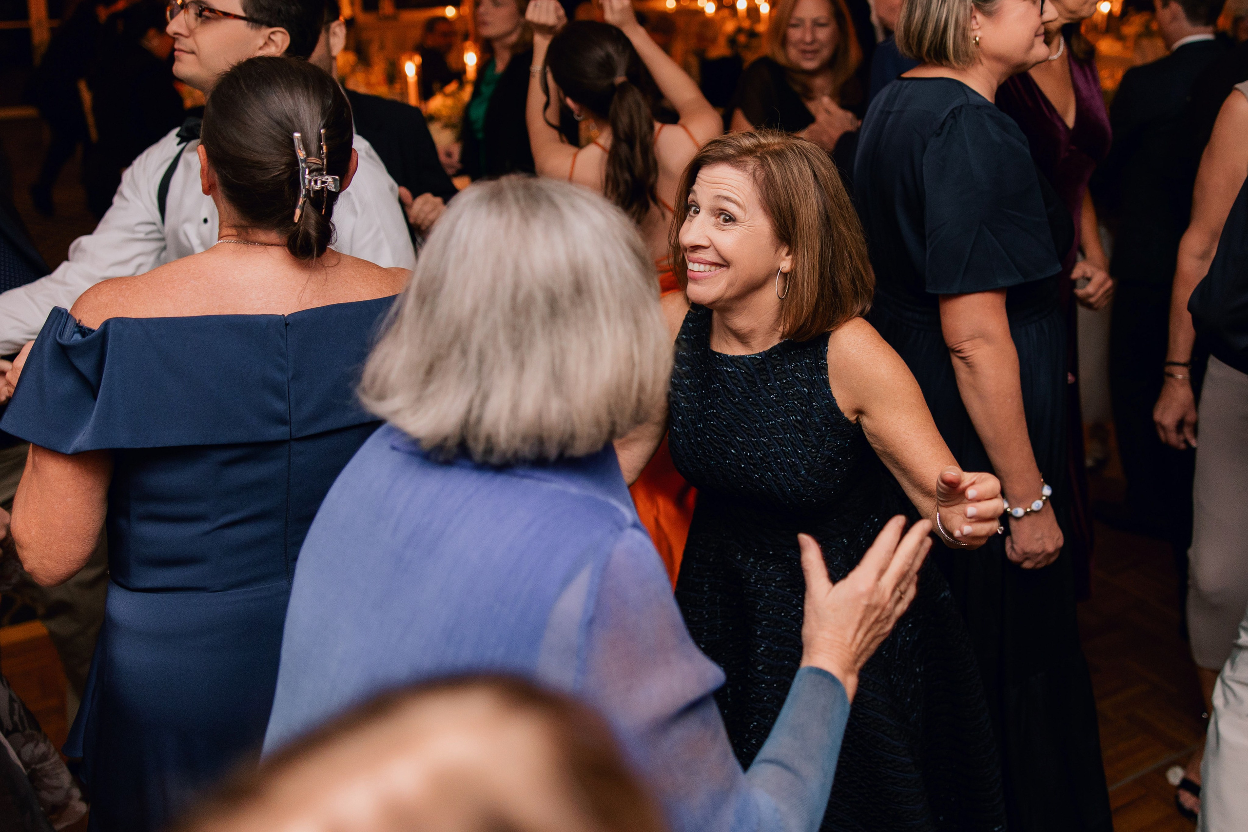 a group of people dancing at a party