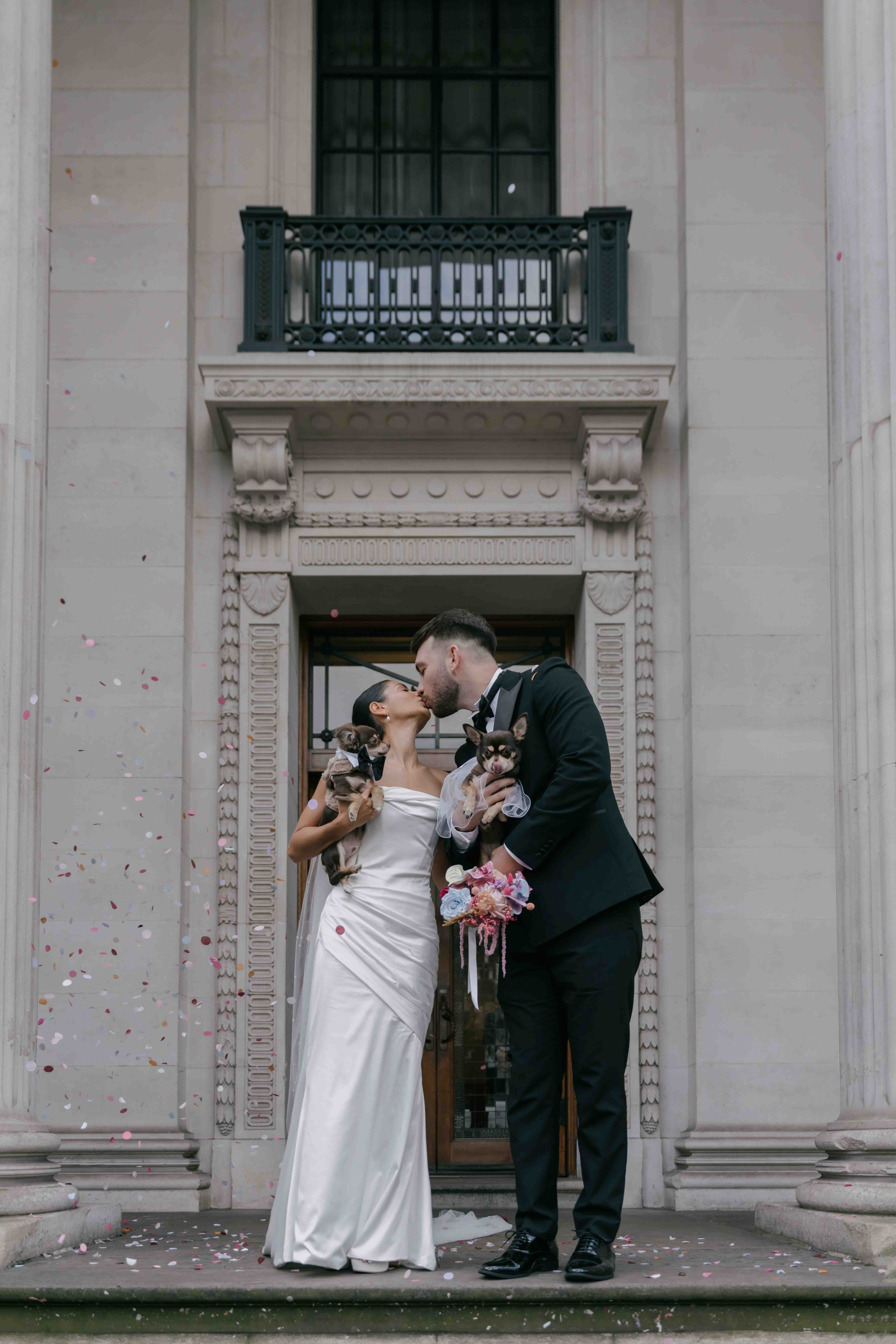 confetti moment Marylebone Town Hall wedding London bride and groom just married candid joyful intimate wedding photography UK